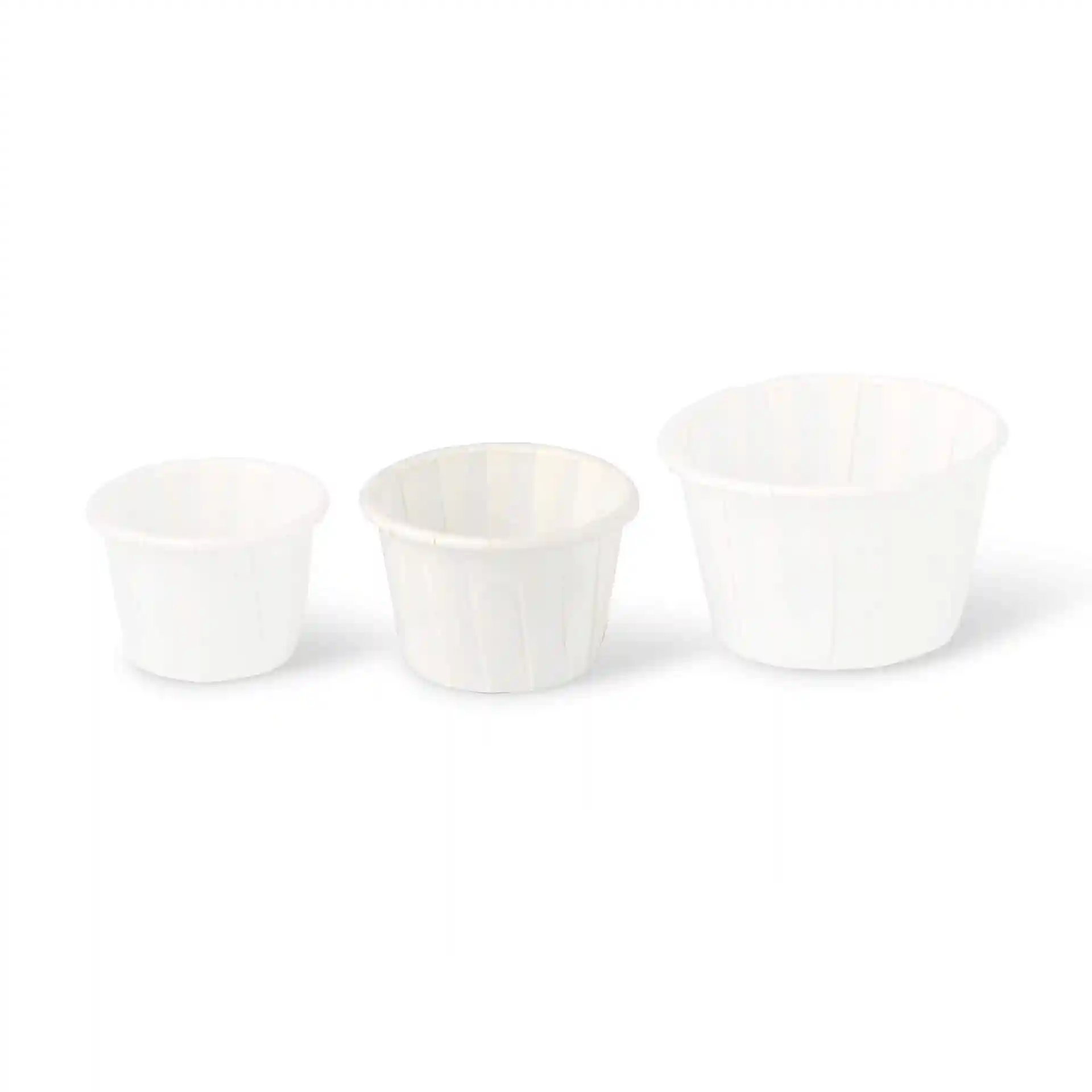 Image of three white paper cups of varying sizes, with the largest cup on the right.