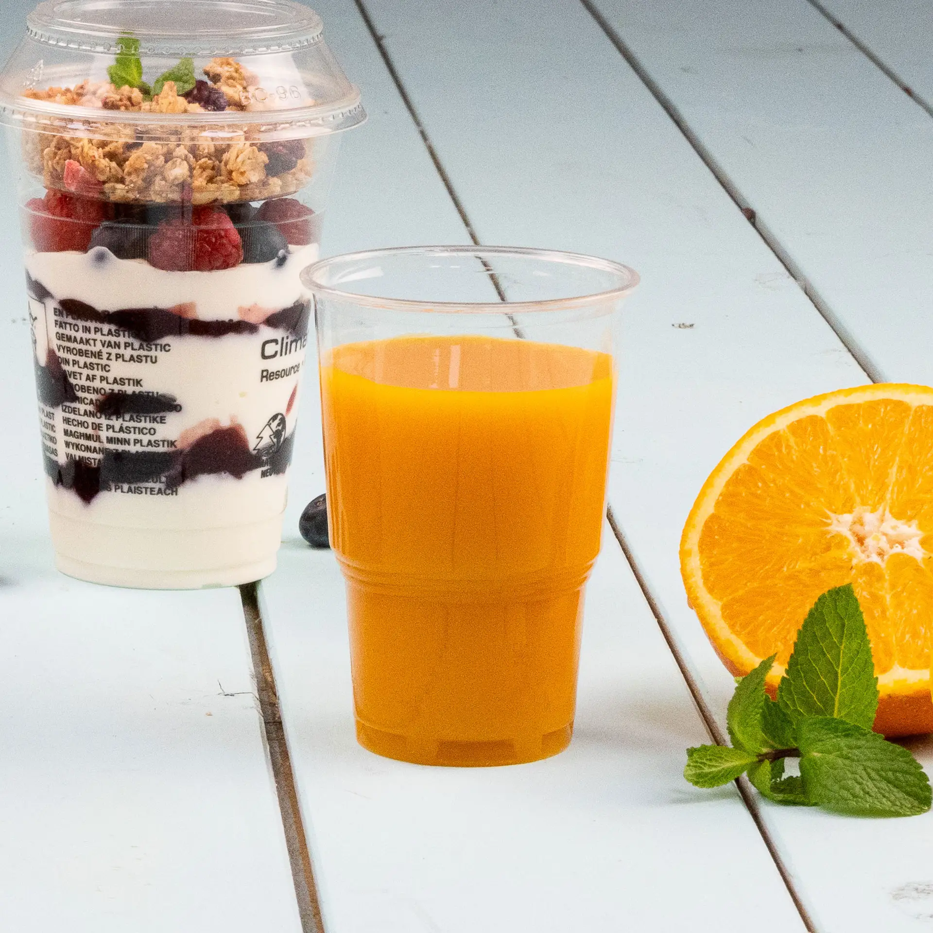 One clear biodegradable PLACup, 250 ml, designed for cold drinks; shown partially below more similar cups.