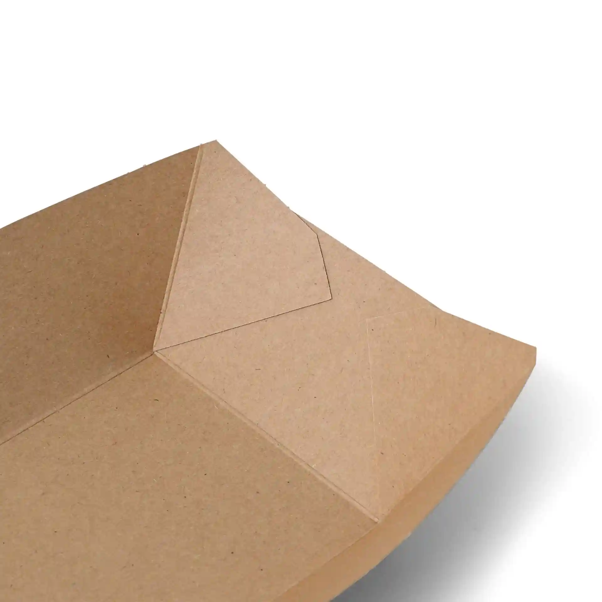 Close-up view of a brown cardboard food tray with a rectangular shape and visible folded edges.