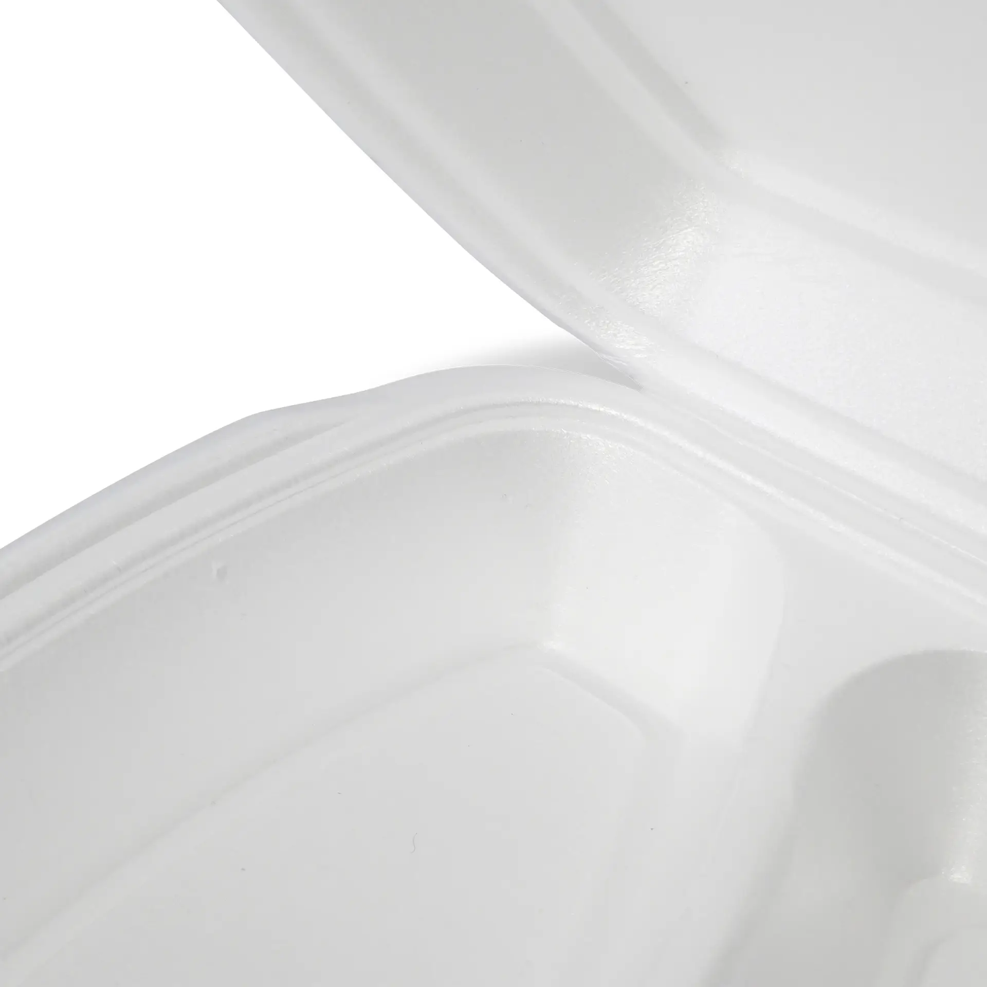 White clamshell food container with a hinged lid, showing interior view and textured surface.