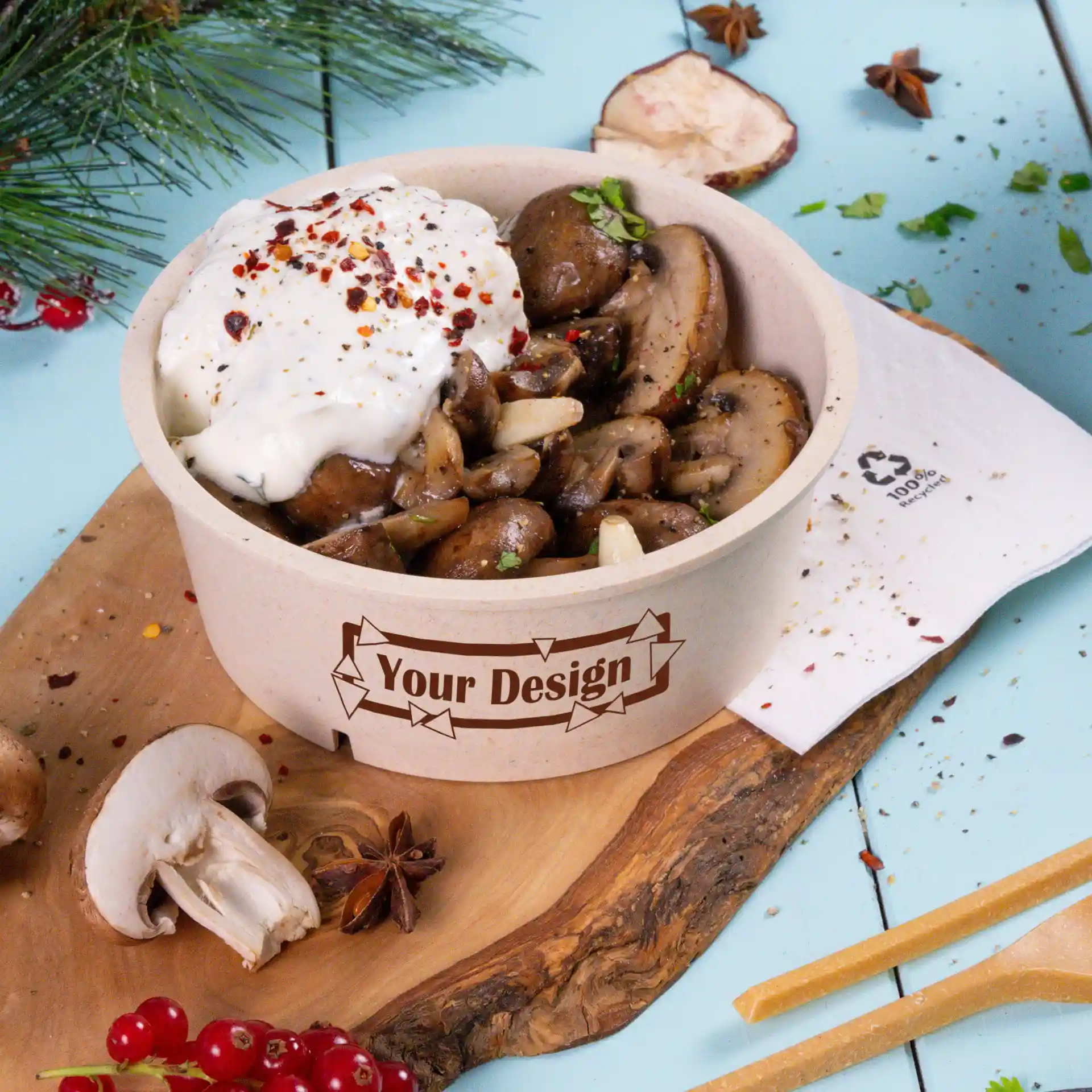 Round cream-white reusable bowl filled with sautéed mushrooms and topped with sour cream, placed on a wooden board.