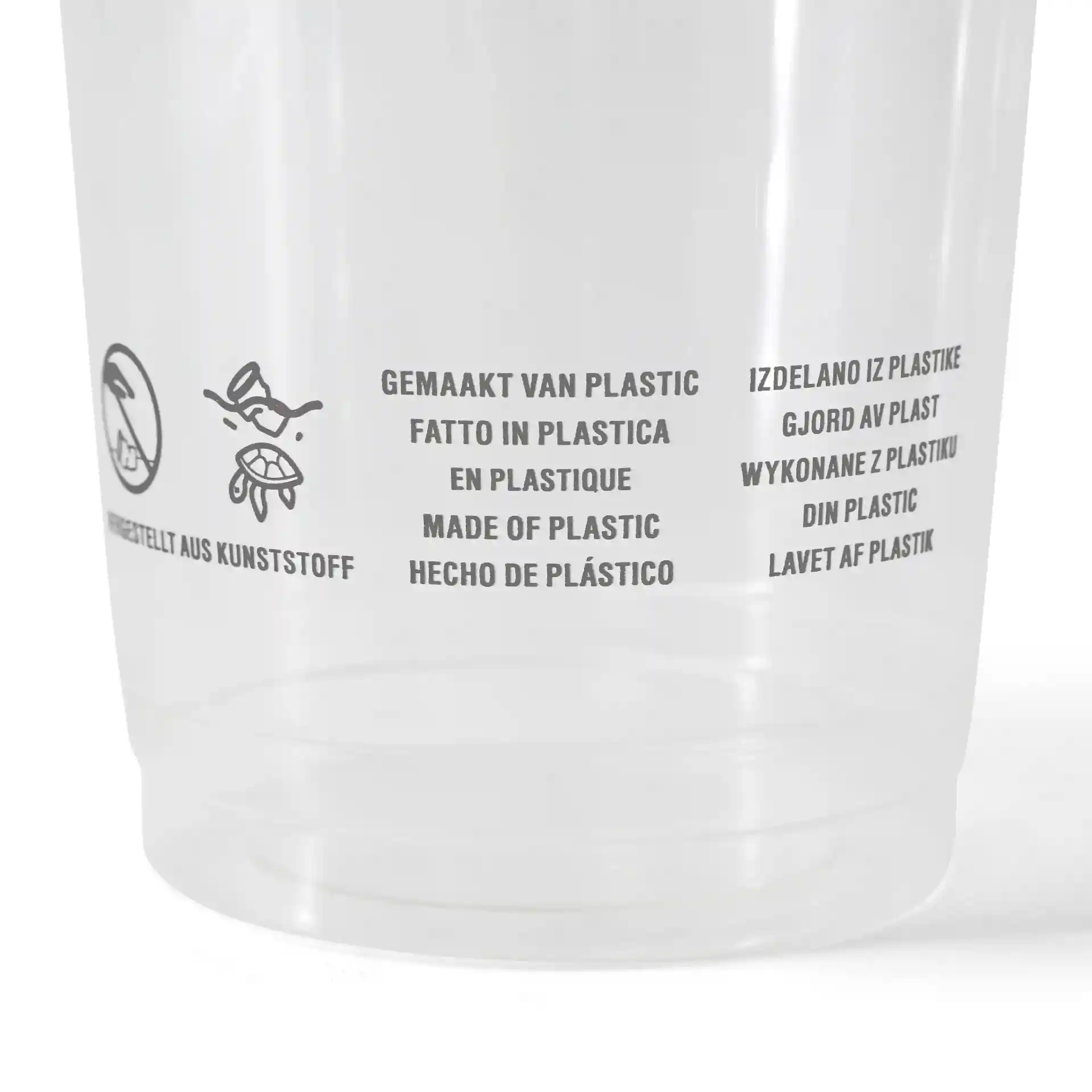 Clear plastic cup with printed multilingual text and symbols, indicating material and usage instructions.