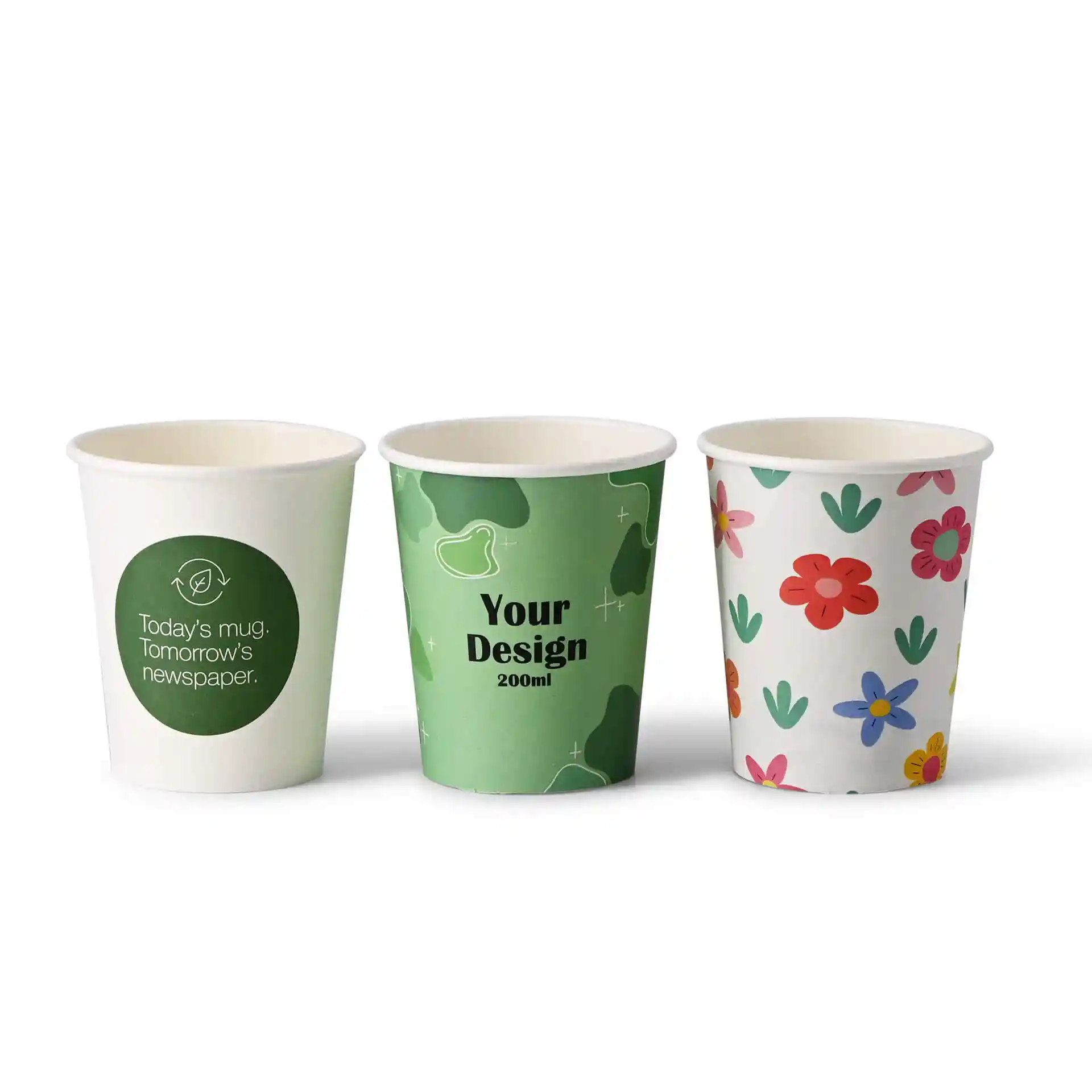 Three paper cups with different designs: one with a green logo, one with a green pattern, and one with colorful flowers.