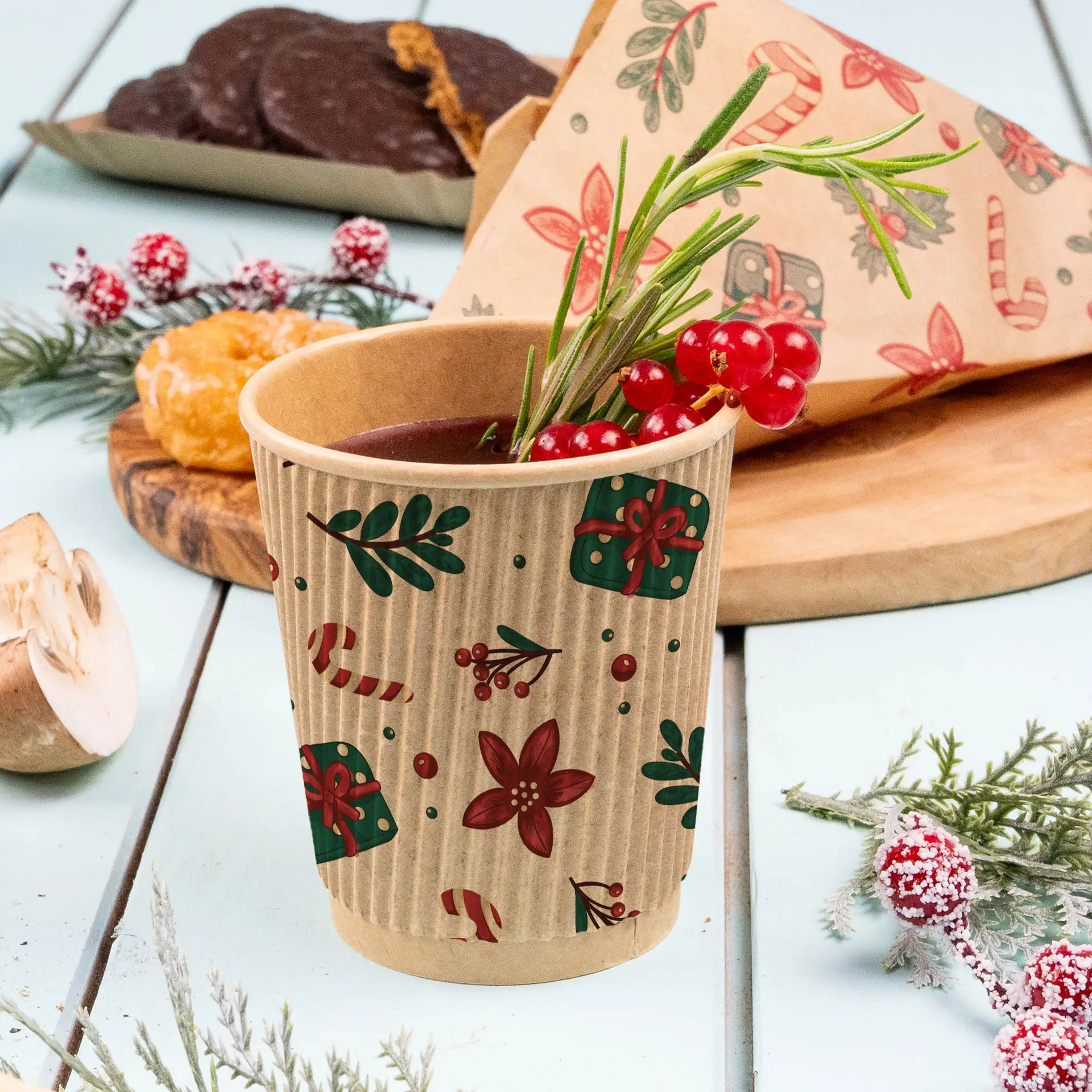 Brown ripple cup with winter design, filled with a drink and garnished with berries and herbs, on a light blue surface.