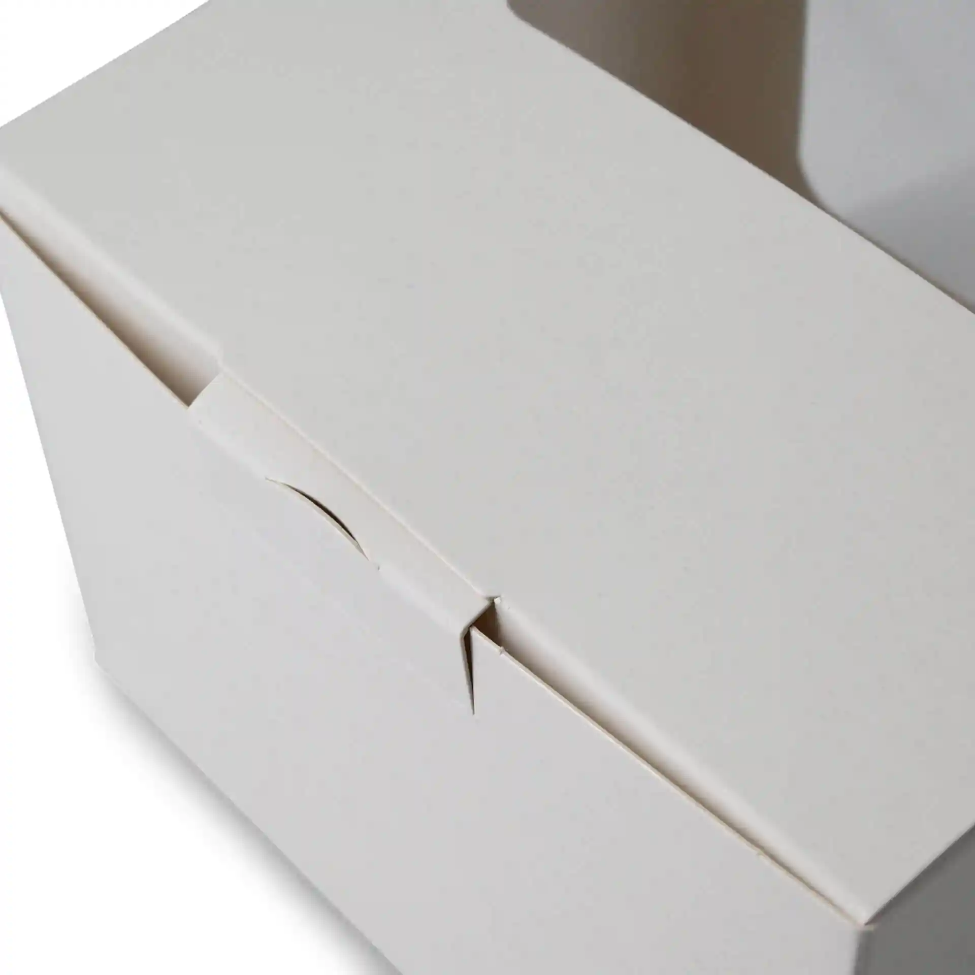 White pastry box with a cellulose window, showing the top closure and part of the side. Dimensions are 13 x 11 x 8 cm.
