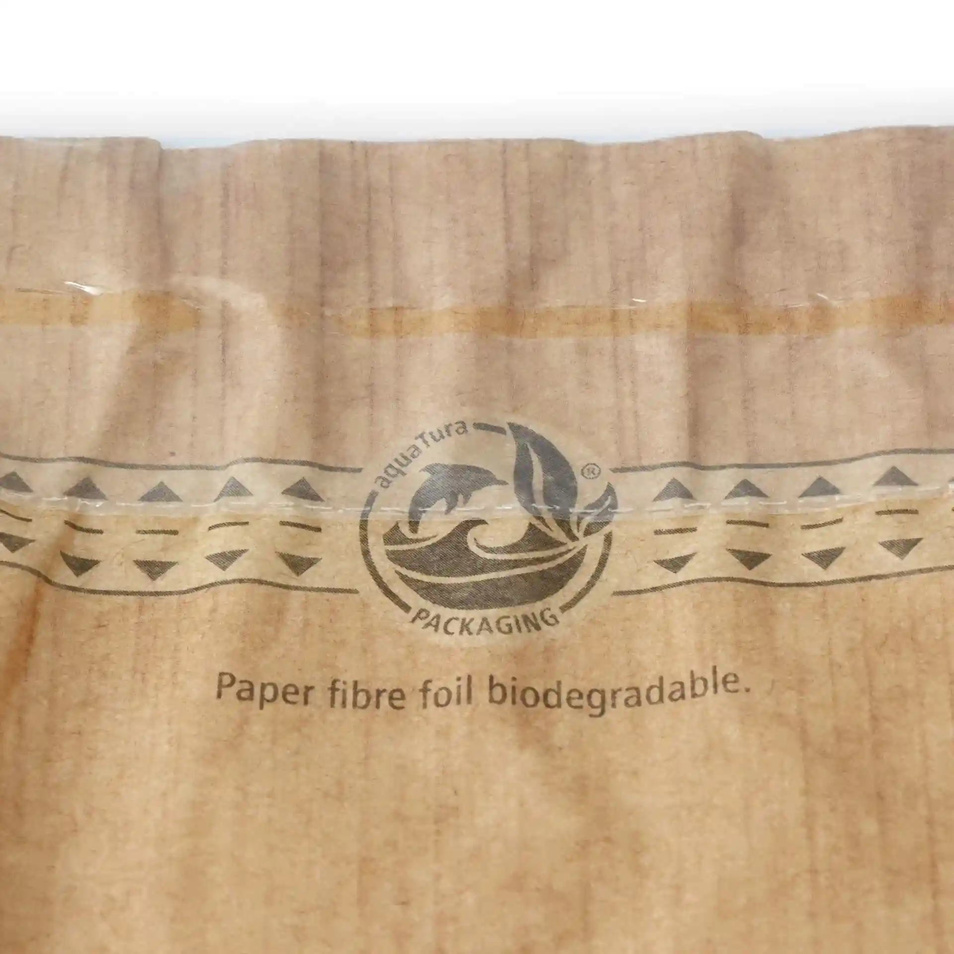 Close-up of a brown snack bag with a window, adhesive seal, and a circular logo with a dolphin design.