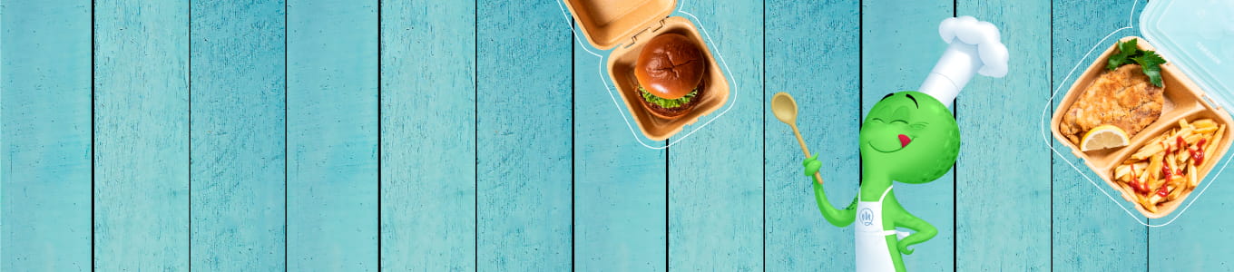 Chef character with a green head and white hat, holding a spoon; two food containers with a burger and a meal with fries and chicken on a blue wooden background.