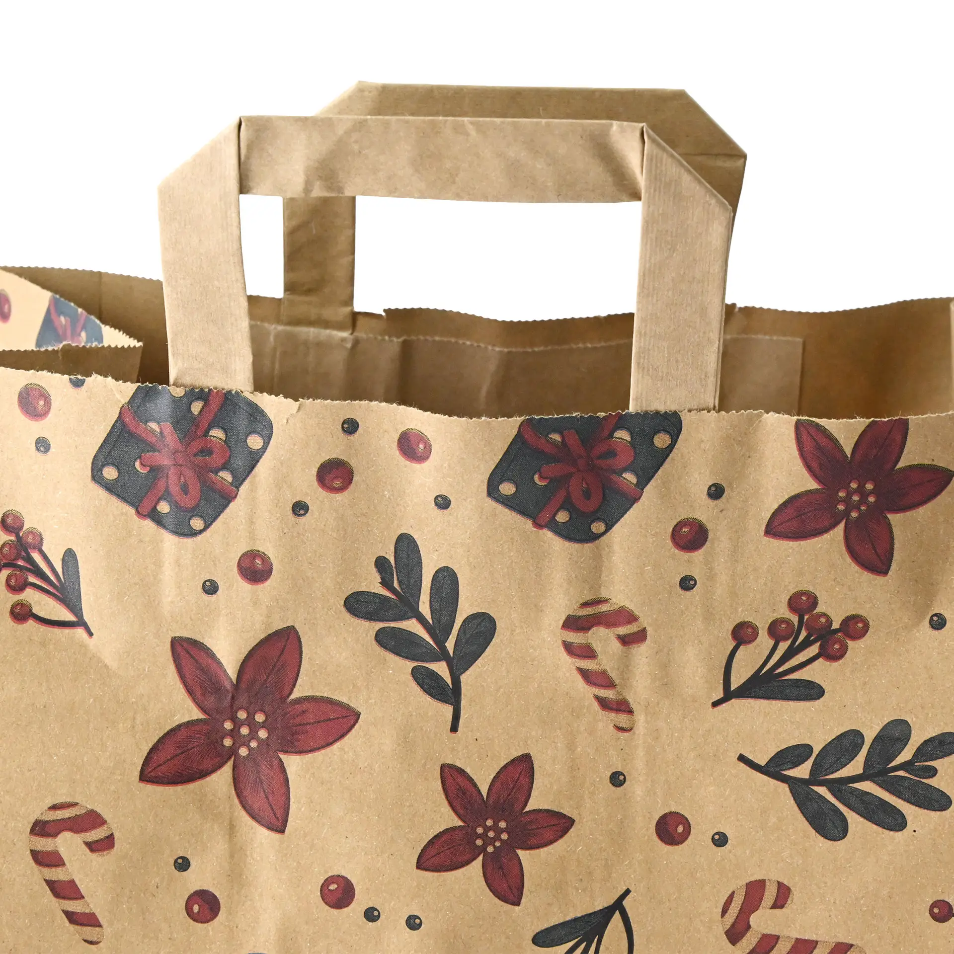 Brown paper carrier bag with winter design, featuring floral and candy cane patterns, dimensions 26 x 17 x 25 cm.