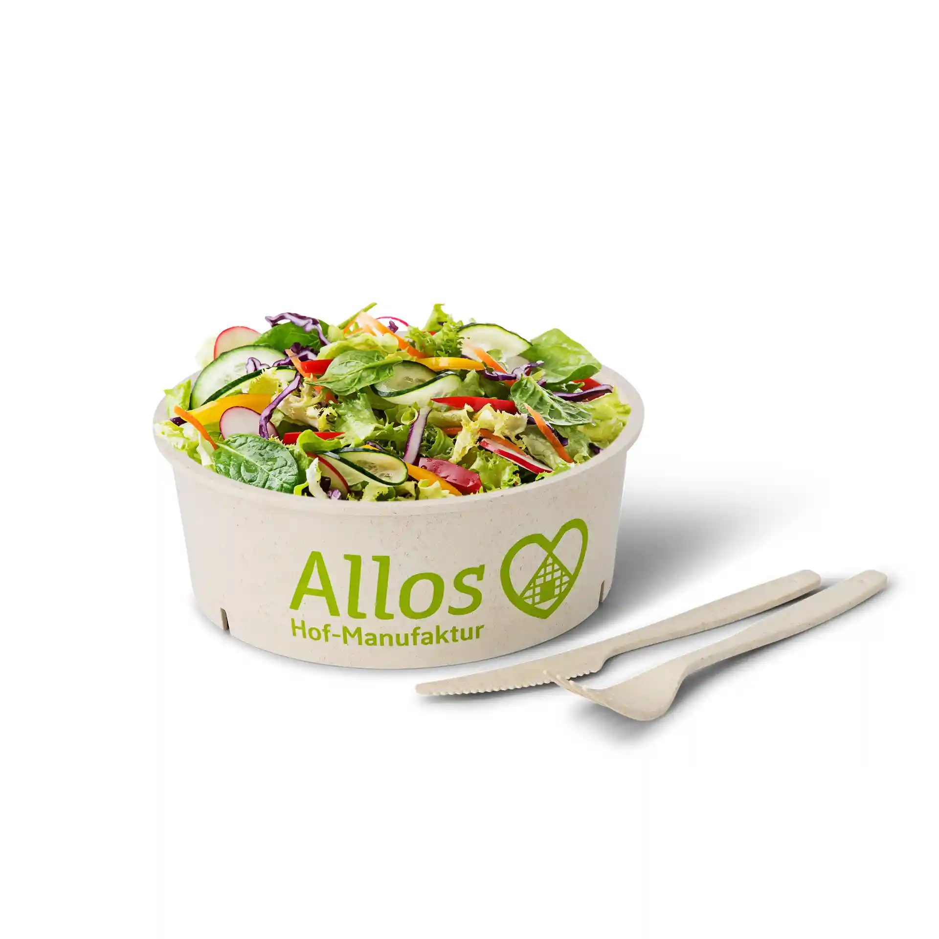 Round cream-white bowl filled with salad, accompanied by a beige fork and knife on a plain background.