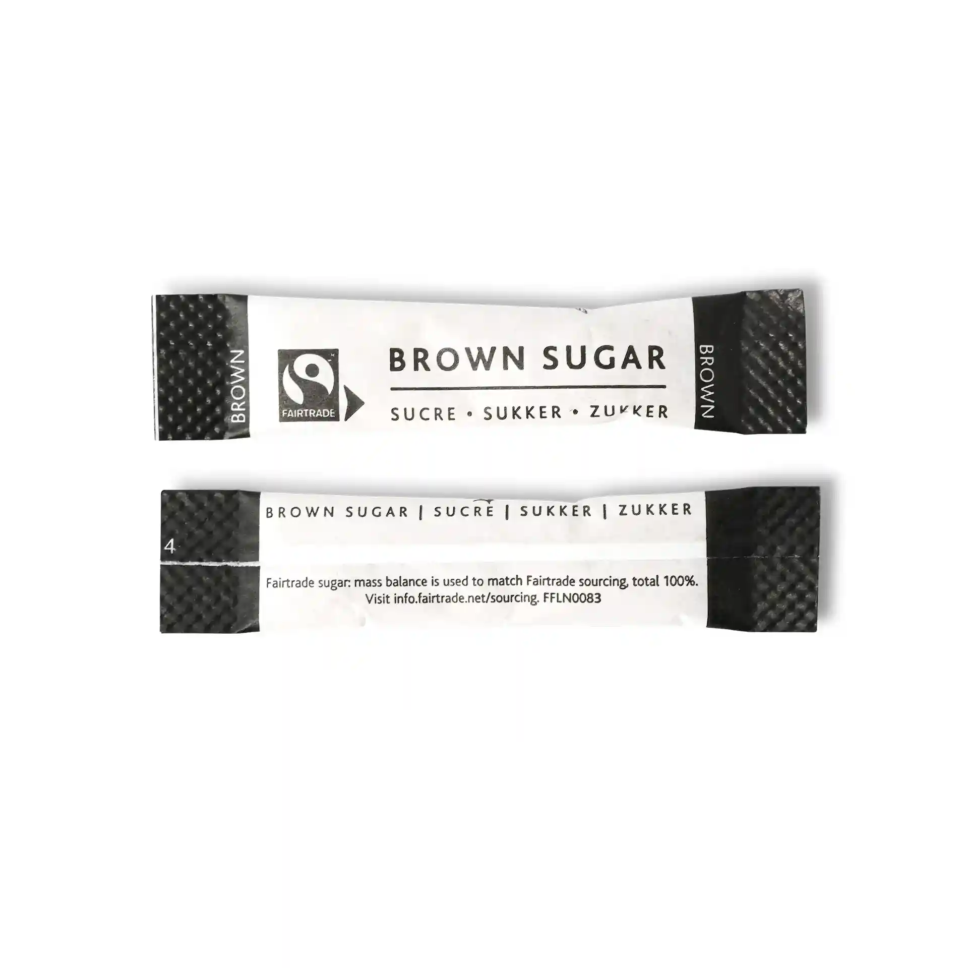 Brown sugar stick with Fairtrade logo, measuring 74 mm by 16 mm, featuring text in multiple languages.