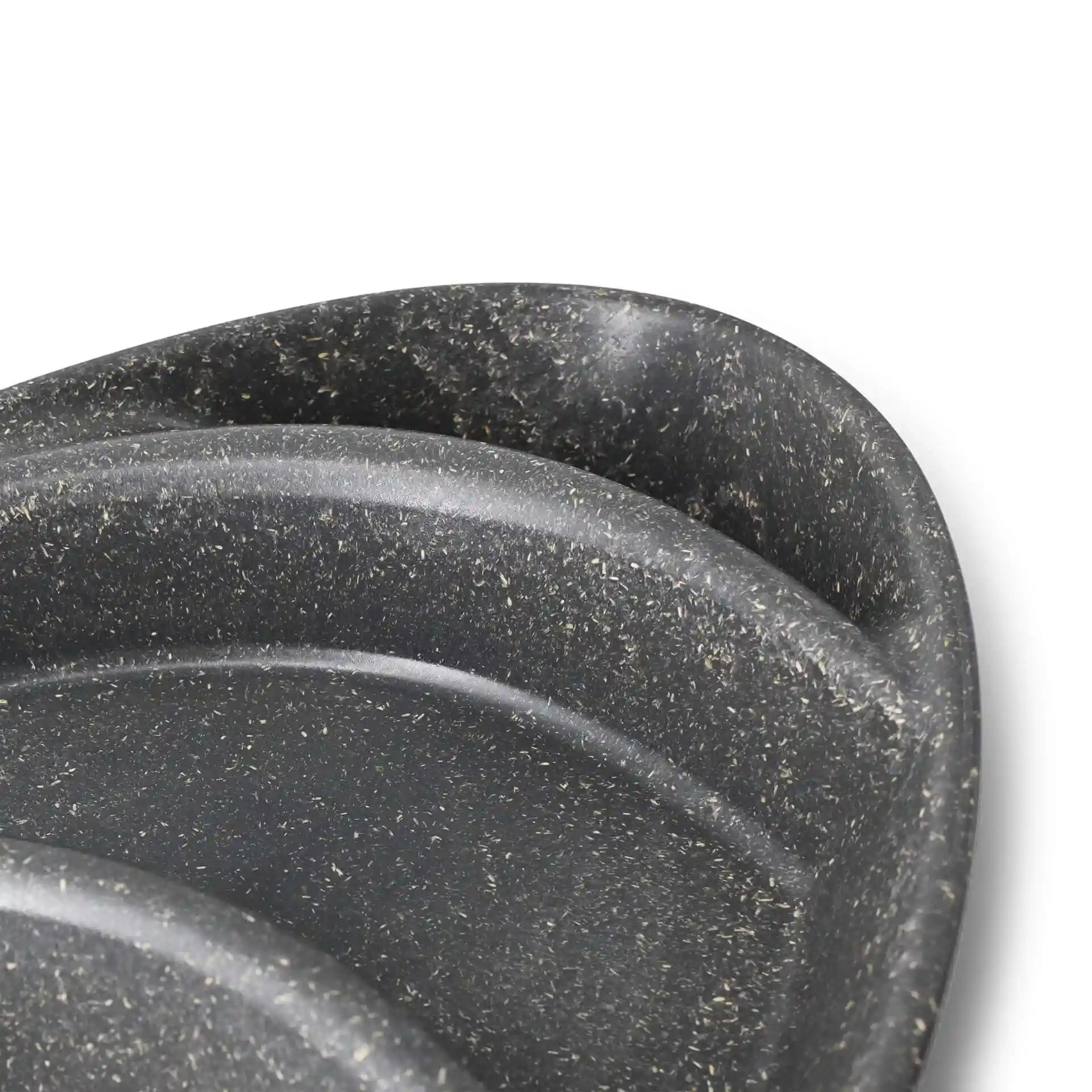Image of a grey reusable divided plate with three compartments, showing a close-up of the edges and surface texture.