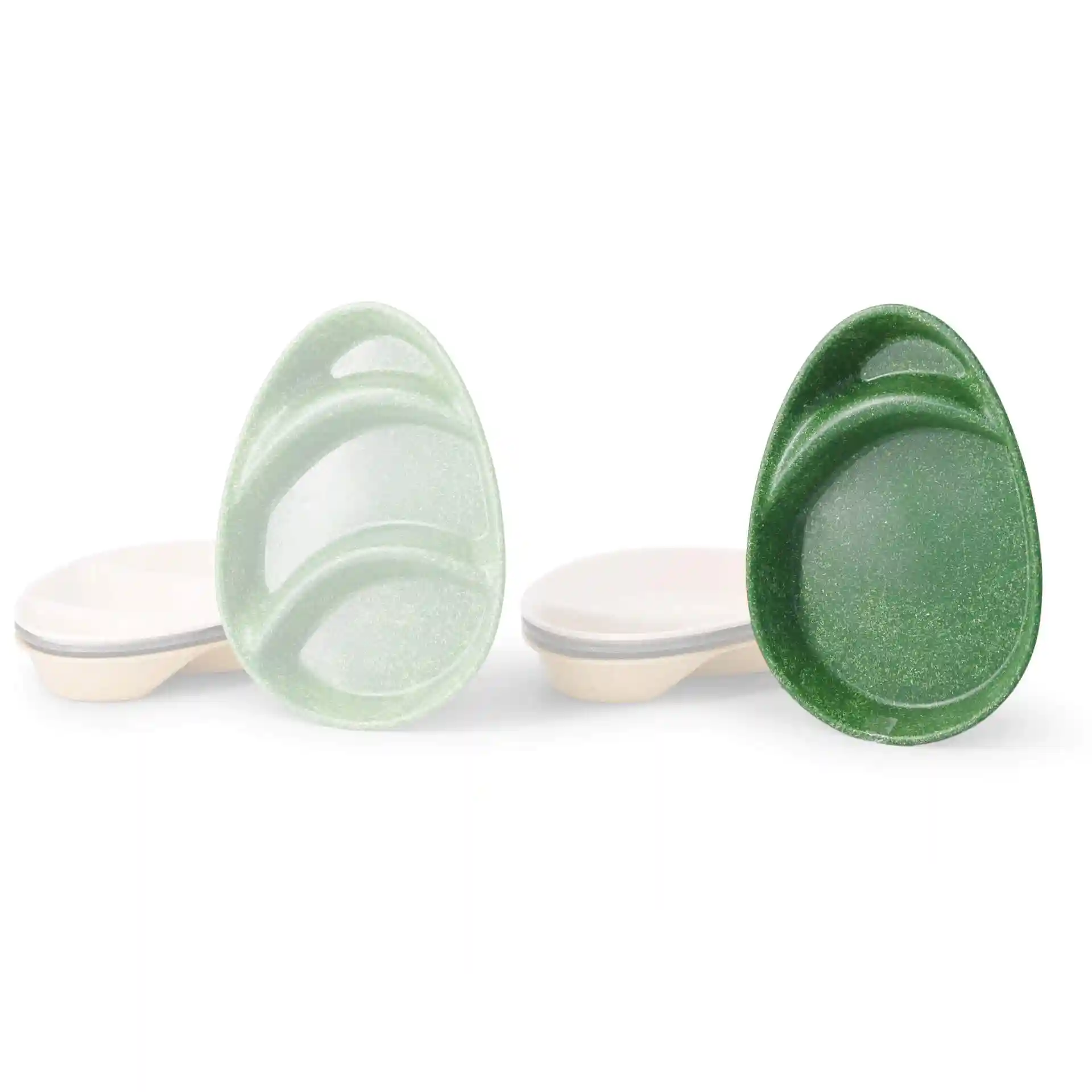 Teardrop-shaped divided plates in light green and dark green, each with two compartments, on a white background.