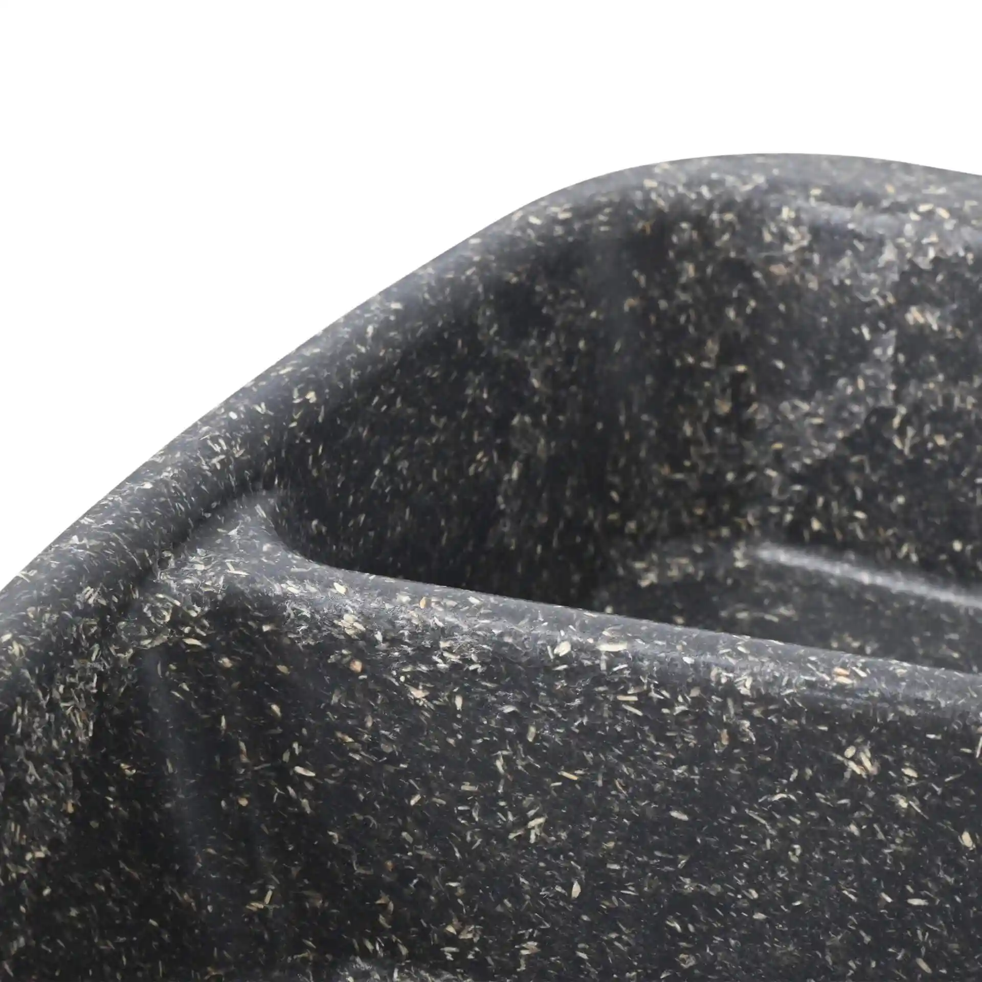 Close-up of a grey reusable meal container with three compartments, showing a textured surface and rounded edges.