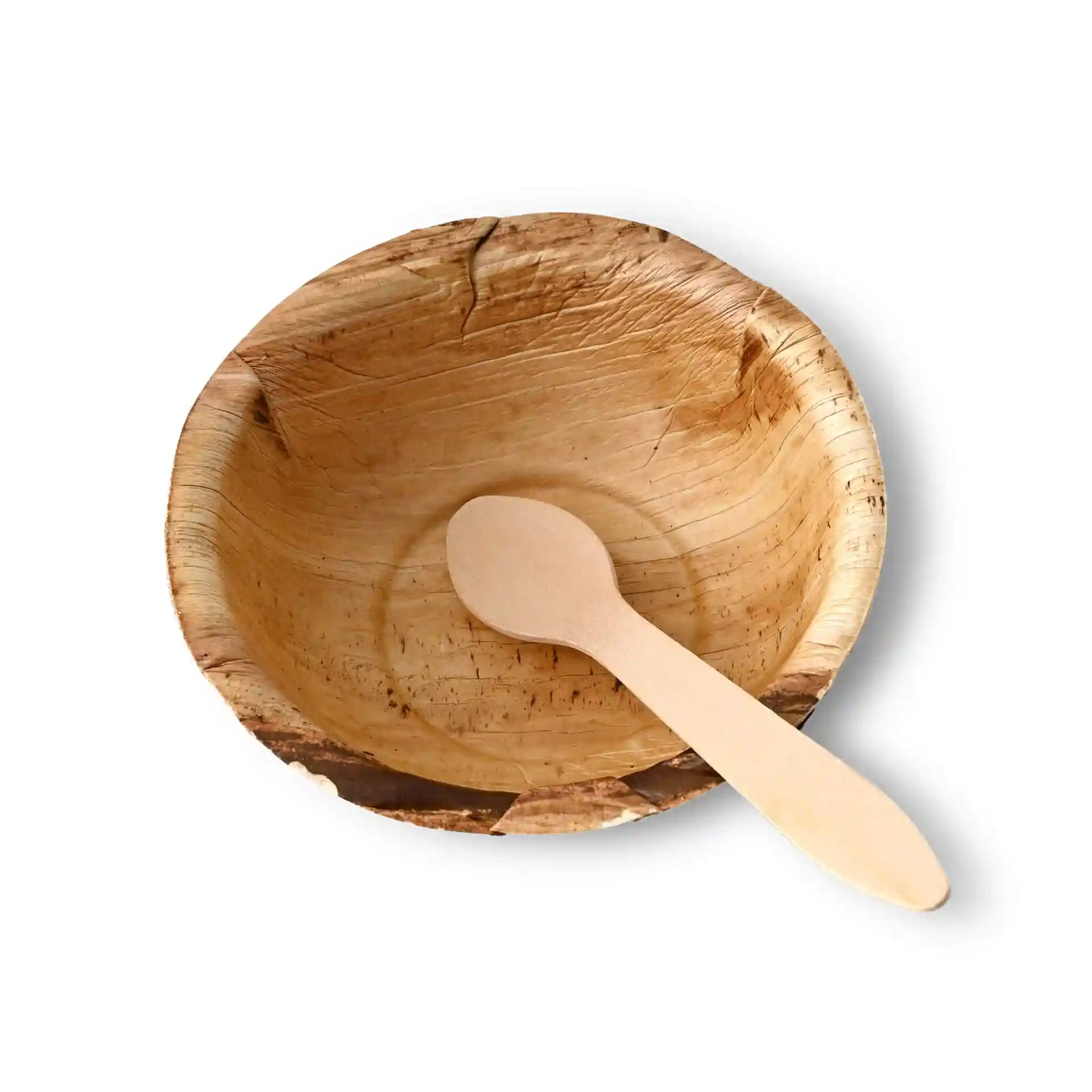 Round palm leaf bowl with a wooden spoon inside, showing a natural grain texture.