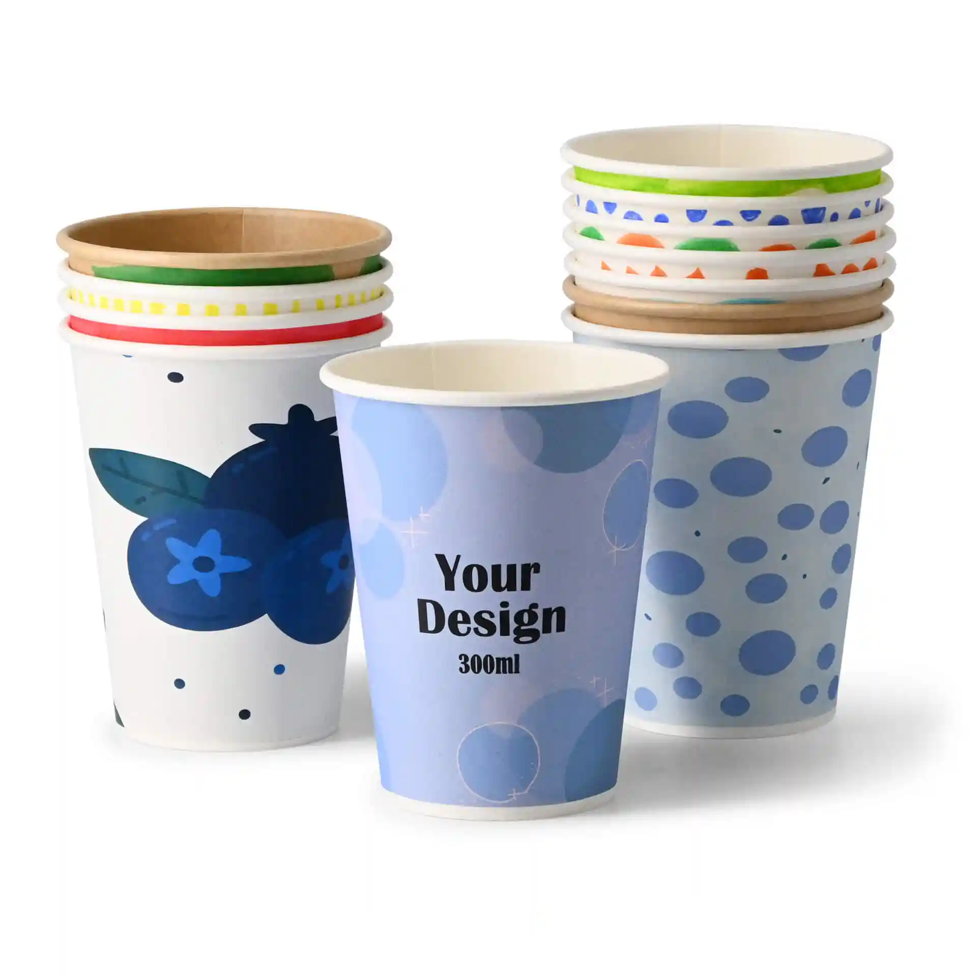 Stack of paper cups with various designs, including a blueberry illustration and a blue polka dot pattern, on a white background.