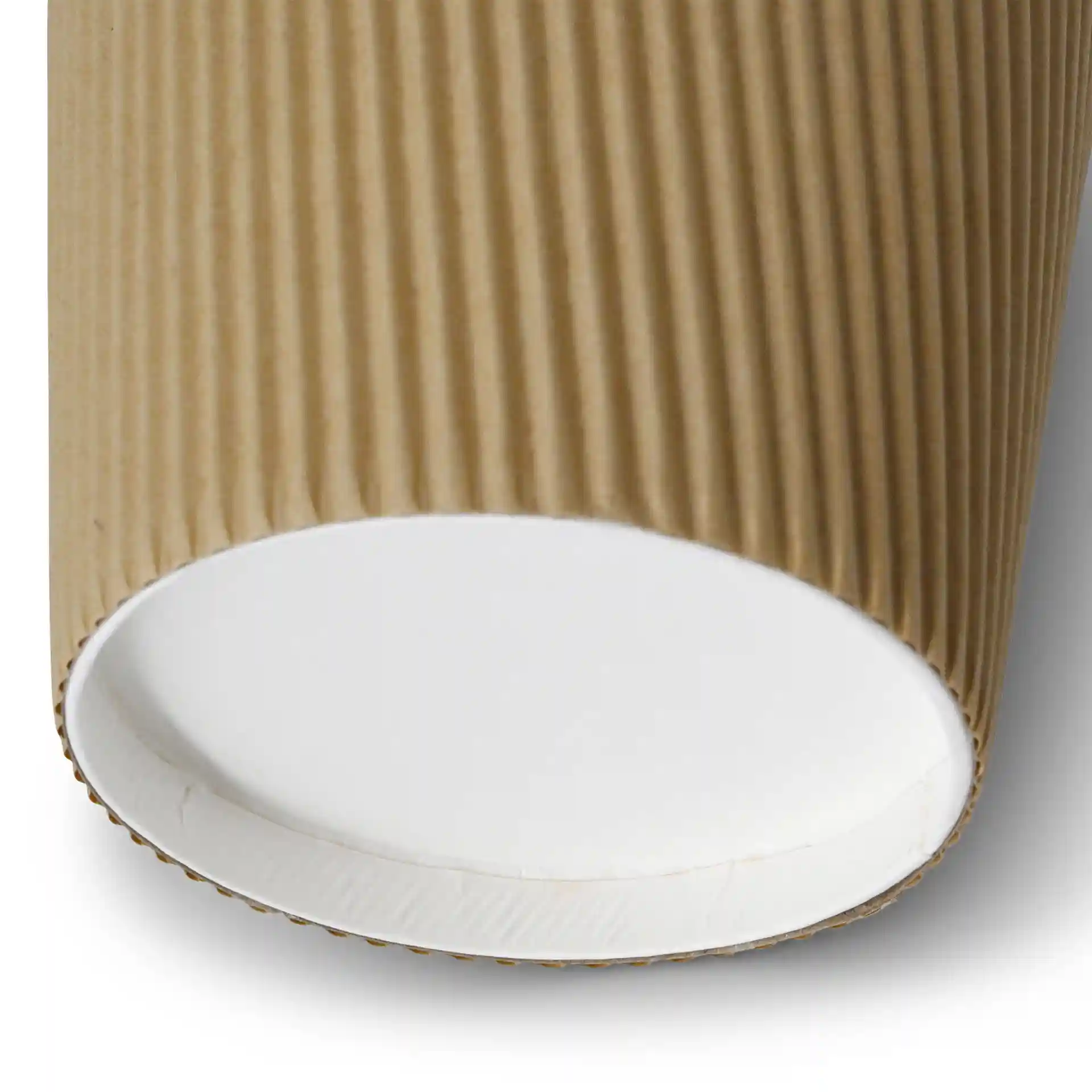 Close-up of a brown ribbed cardboard soup cup with a white interior and a round base.