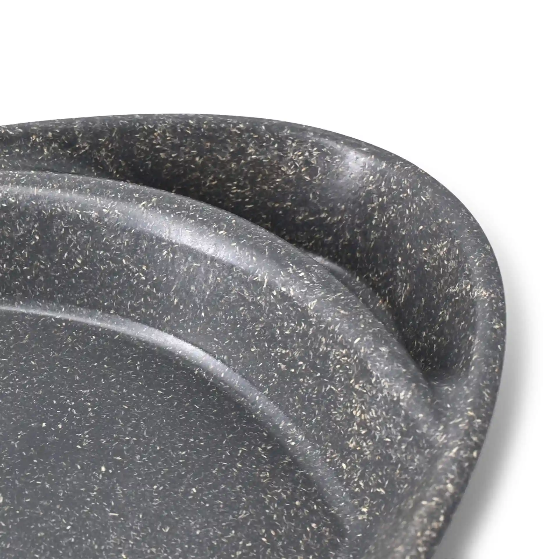 Close-up of a grey reusable divided plate with two compartments, showing a textured surface and rounded edges.