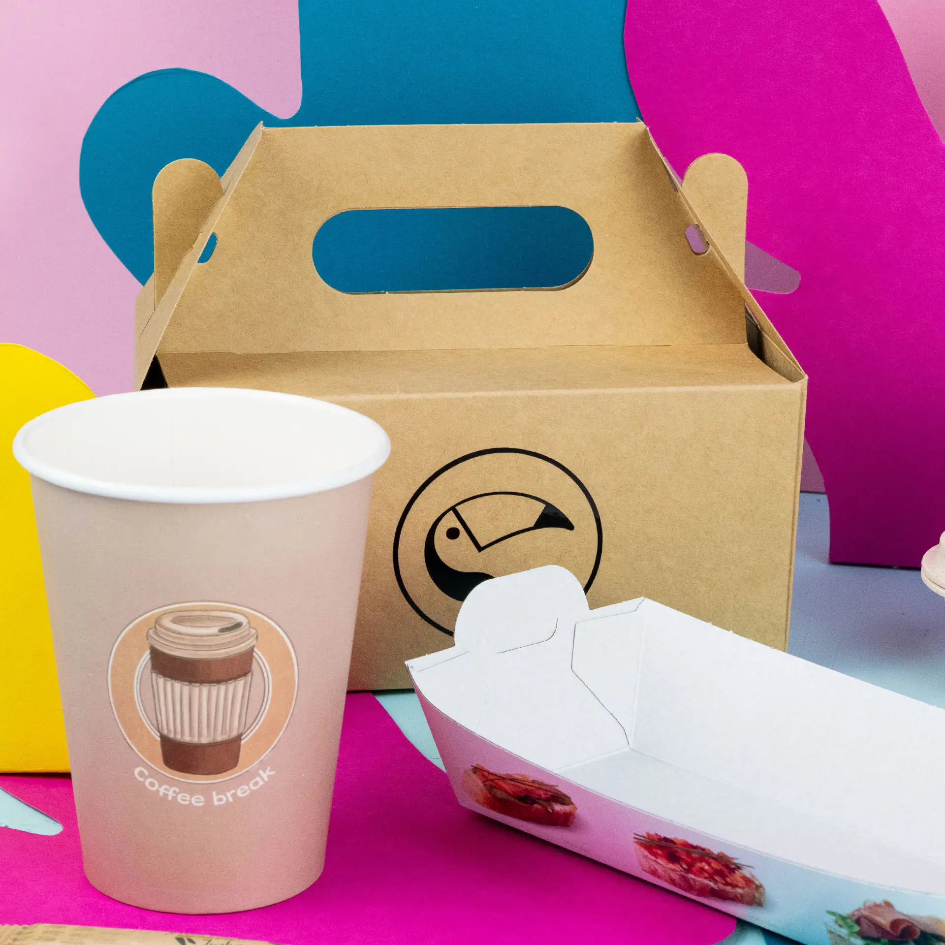 Brown custom printed cake box with a handle, a coffee cup with a label, and a white food container.