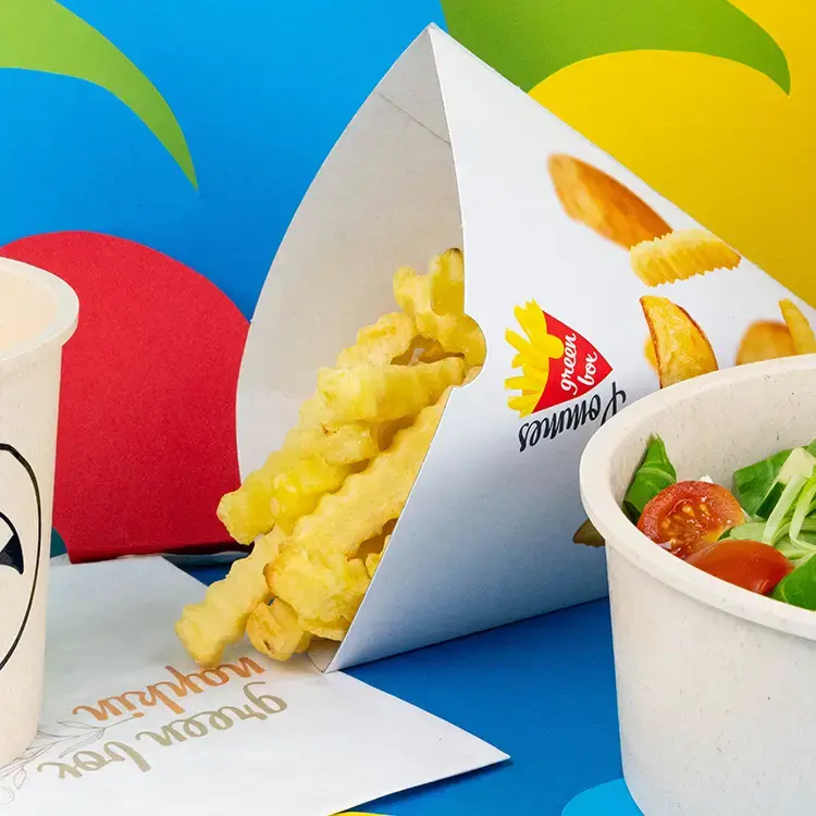 Container filled with golden French fries, with a label reading "Potato Organic," and several fries beside it.
