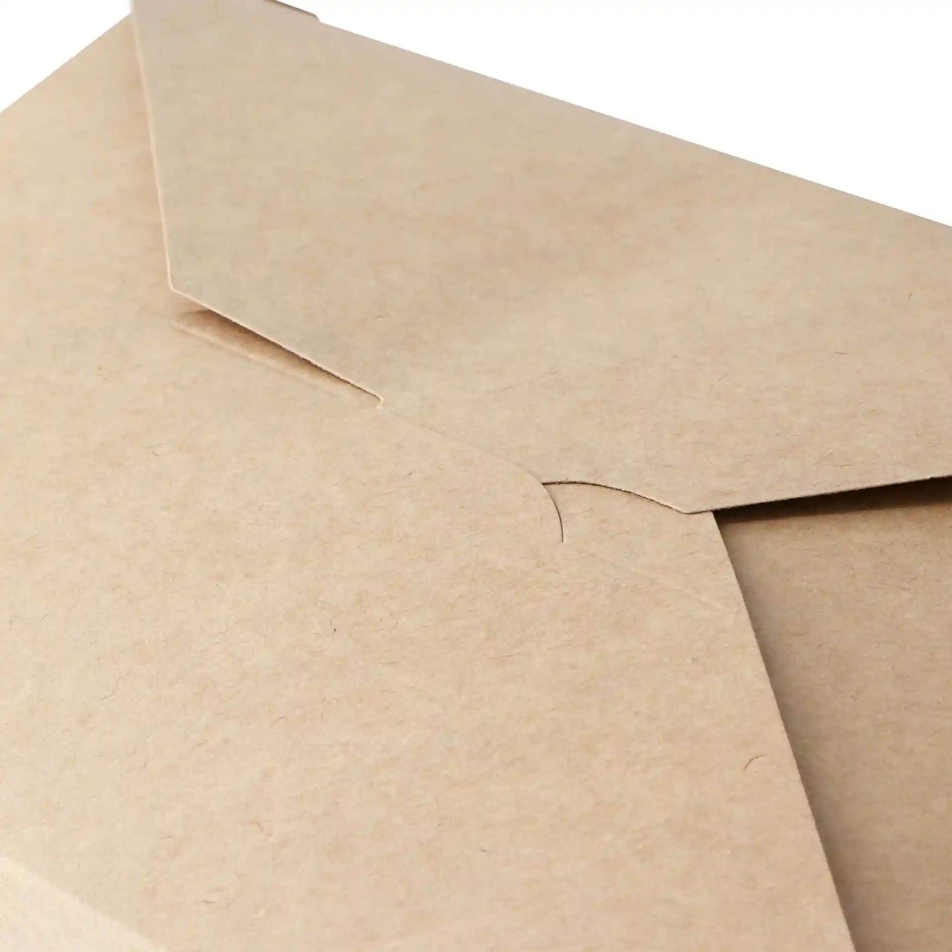 Close-up of a brown cardboard takeaway container with a flap closure, showing the textured surface and edges.