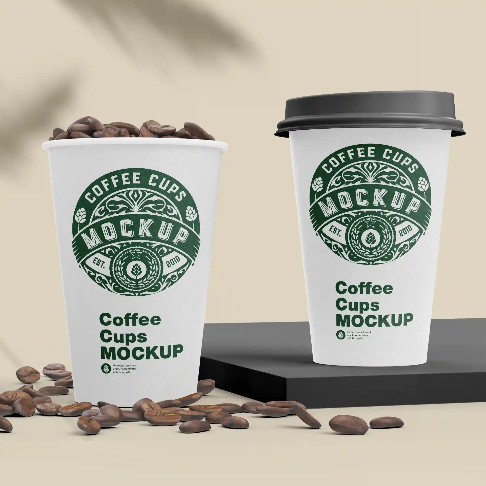 Two white paper cups with green logos, one filled with coffee beans, on a black surface with scattered coffee beans.