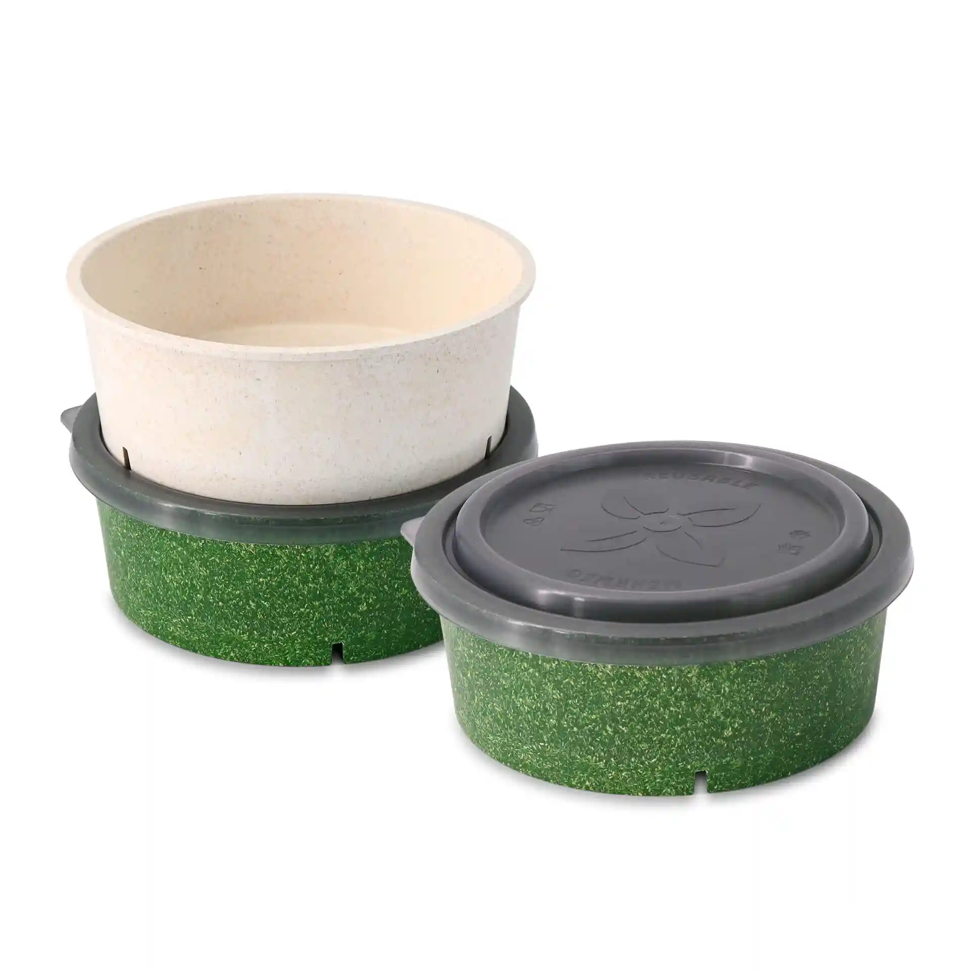 Two round bowls, one cream and one green, with a grey reusable lid on the green bowl.