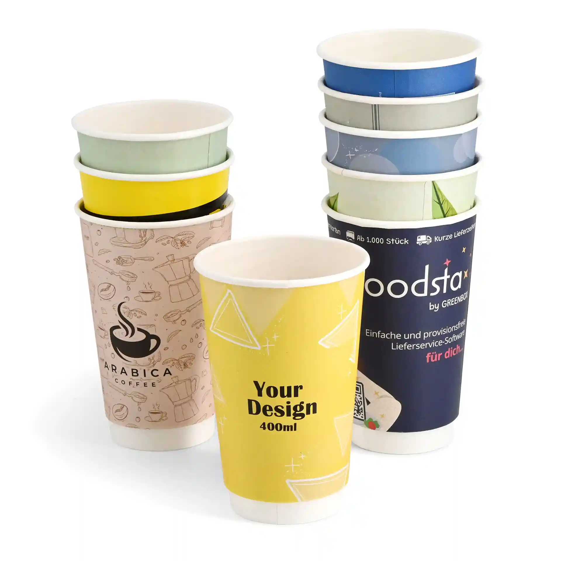 Stack of custom printed paper cups in various designs, featuring a yellow cup with geometric patterns and a coffee-themed cup.