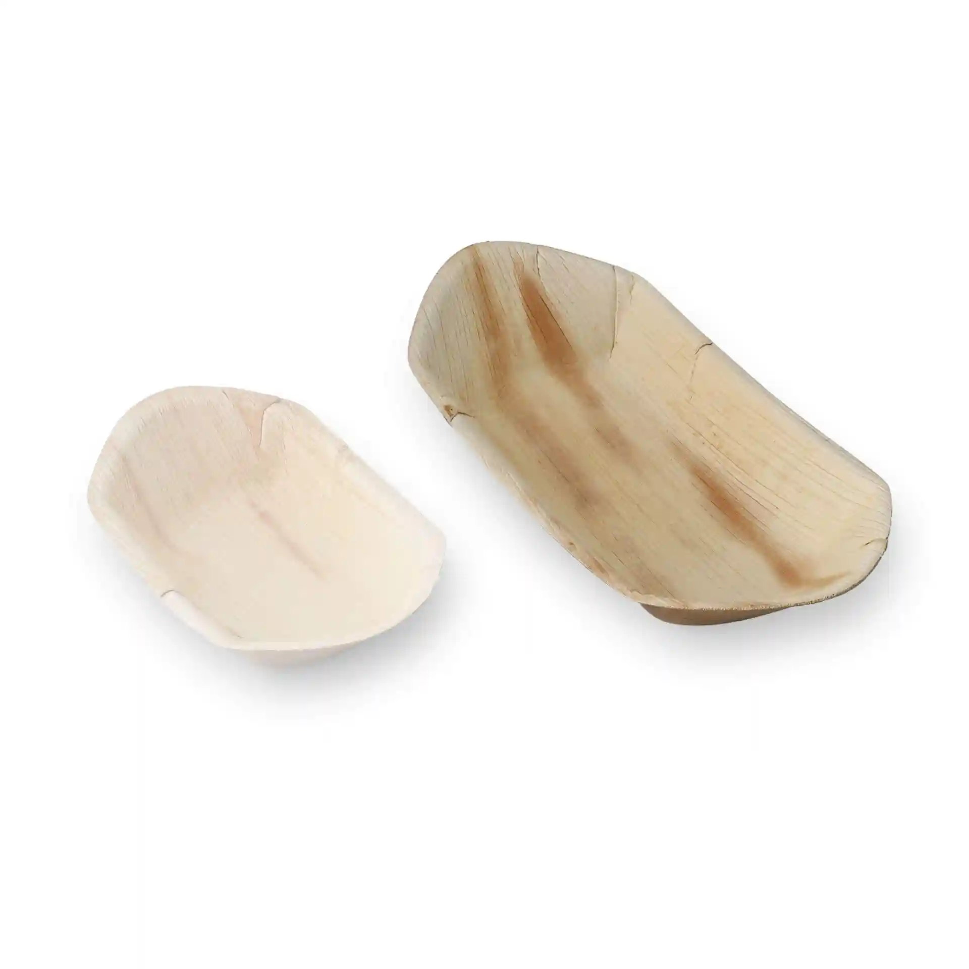 Two palm leaf boat-shaped serving dishes, one larger and one smaller, displayed on a plain background.