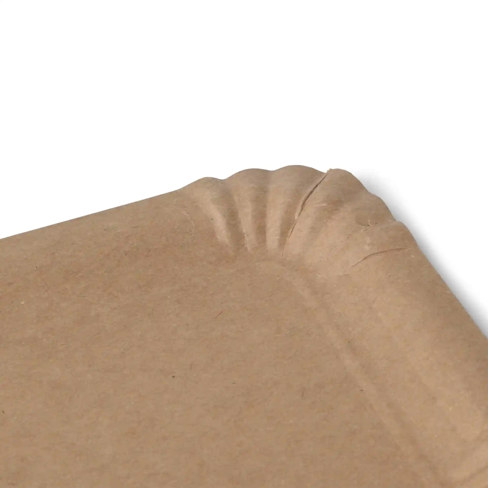 Close-up of a rectangular brown cardboard plate with a fluted edge.