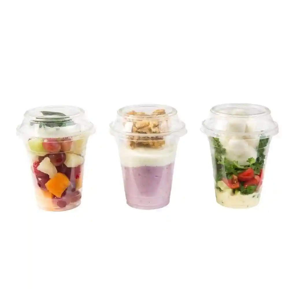 Three transparent cups containing assorted fruits, yogurt with granola, and a salad with mozzarella balls.