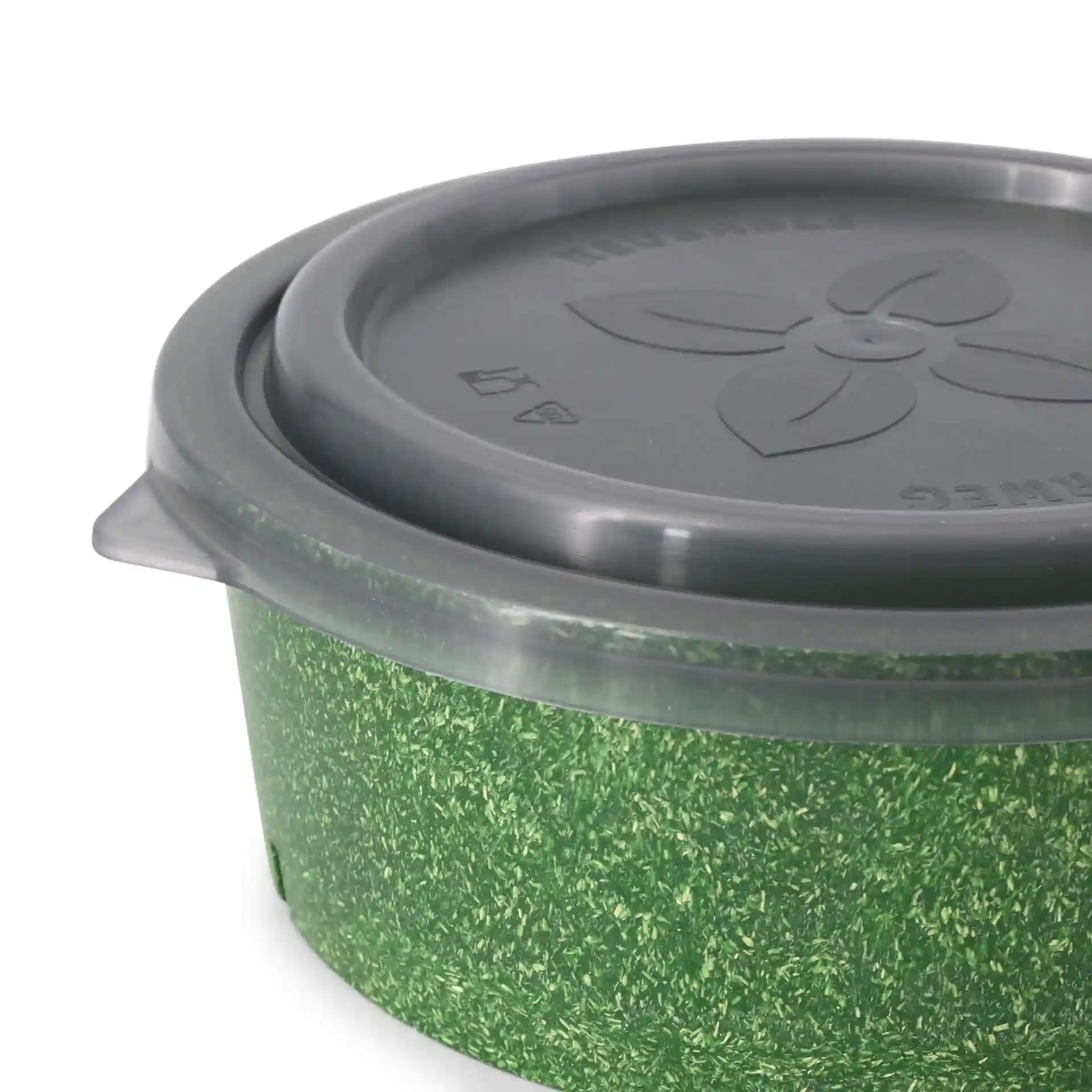 Round bowl with a green exterior and a grey lid, featuring a floral design and markings on the lid.