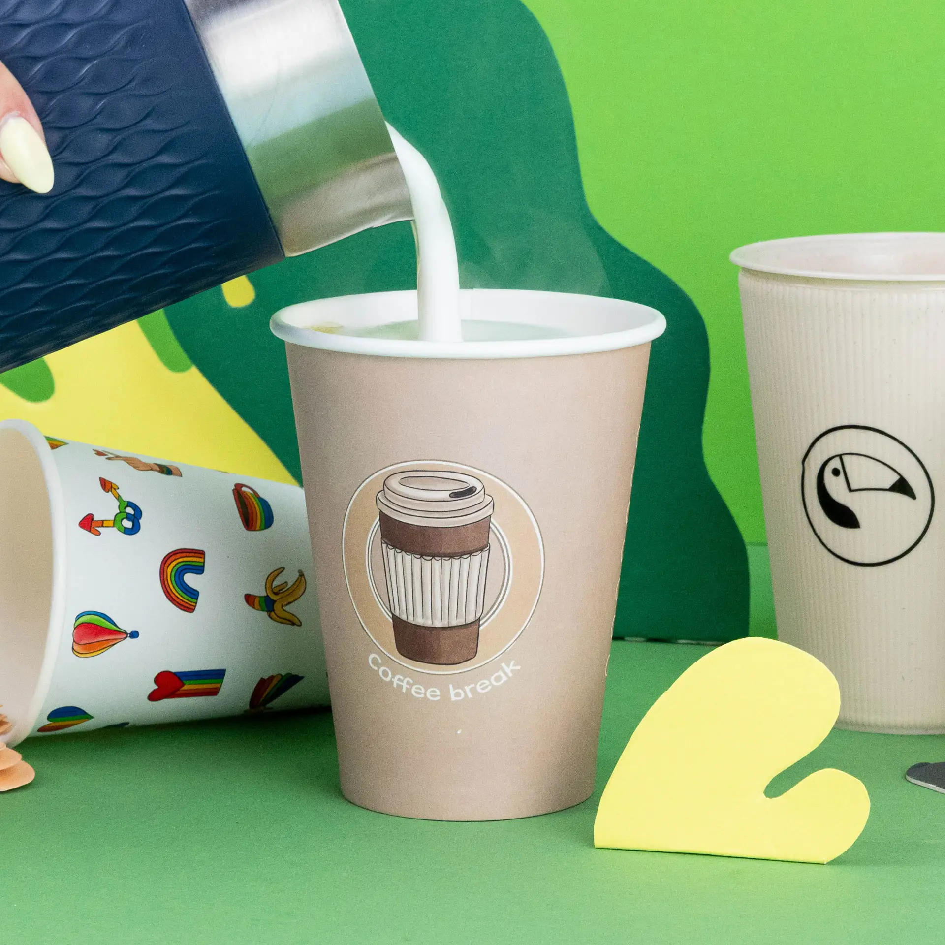 One custom design paper cup, 300ml, with a white base and light blue pattern; displayed on a wooden surface.