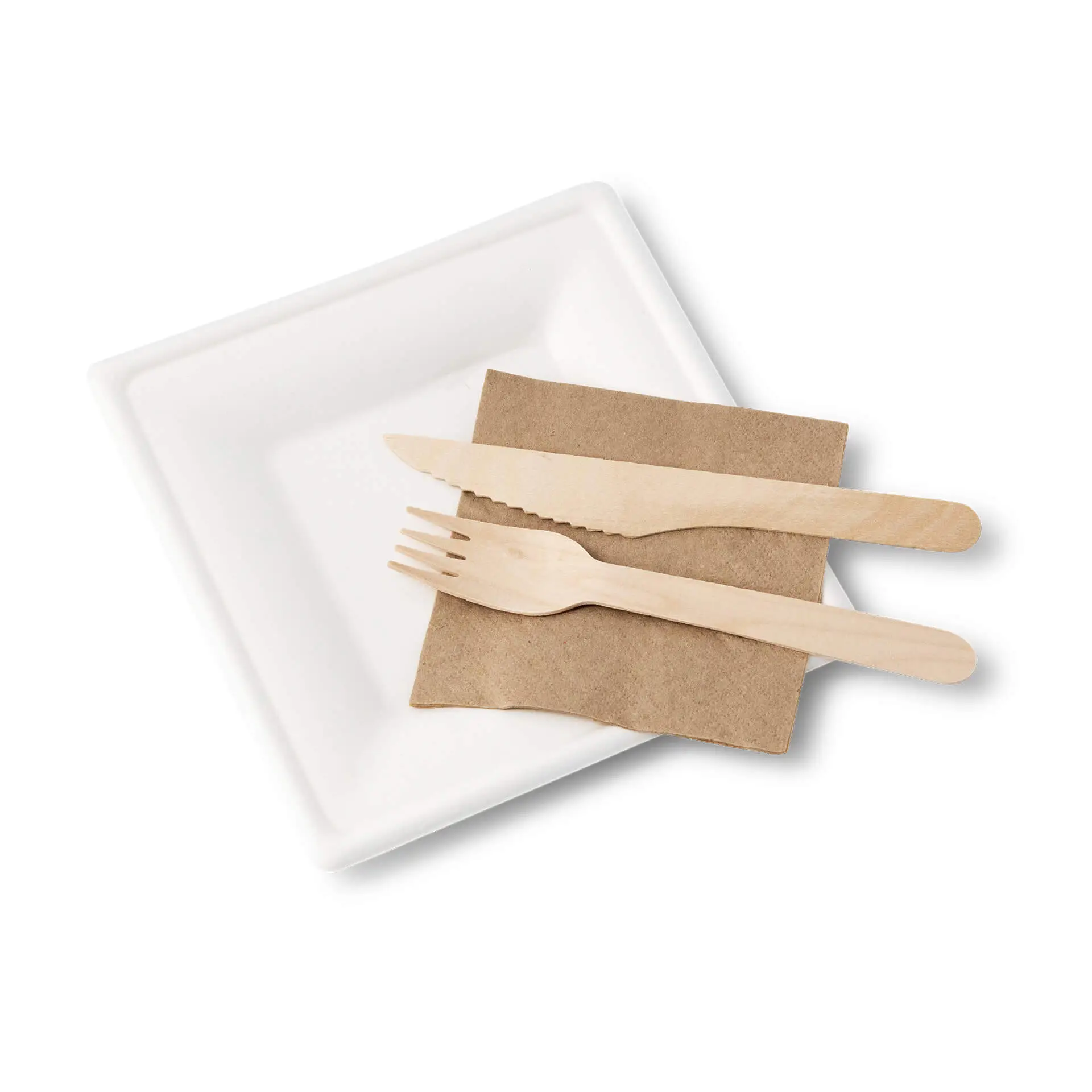 Square sugarcane plate with a knife, fork, and a brown napkin arranged on a white background.