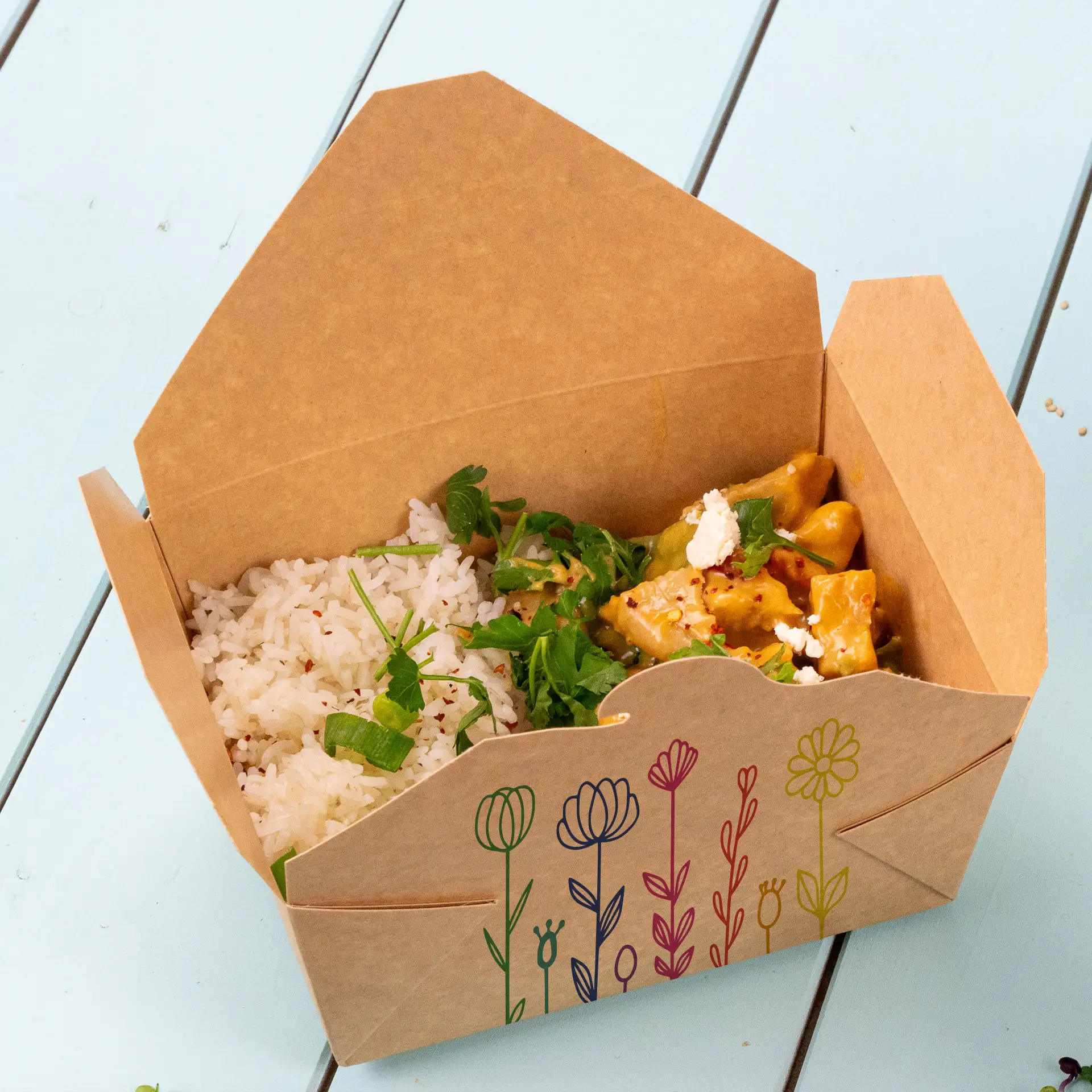 A customizable takeaway box with rice and a saucy dish, decorated with floral print. Ideal for hot meals and delivery.