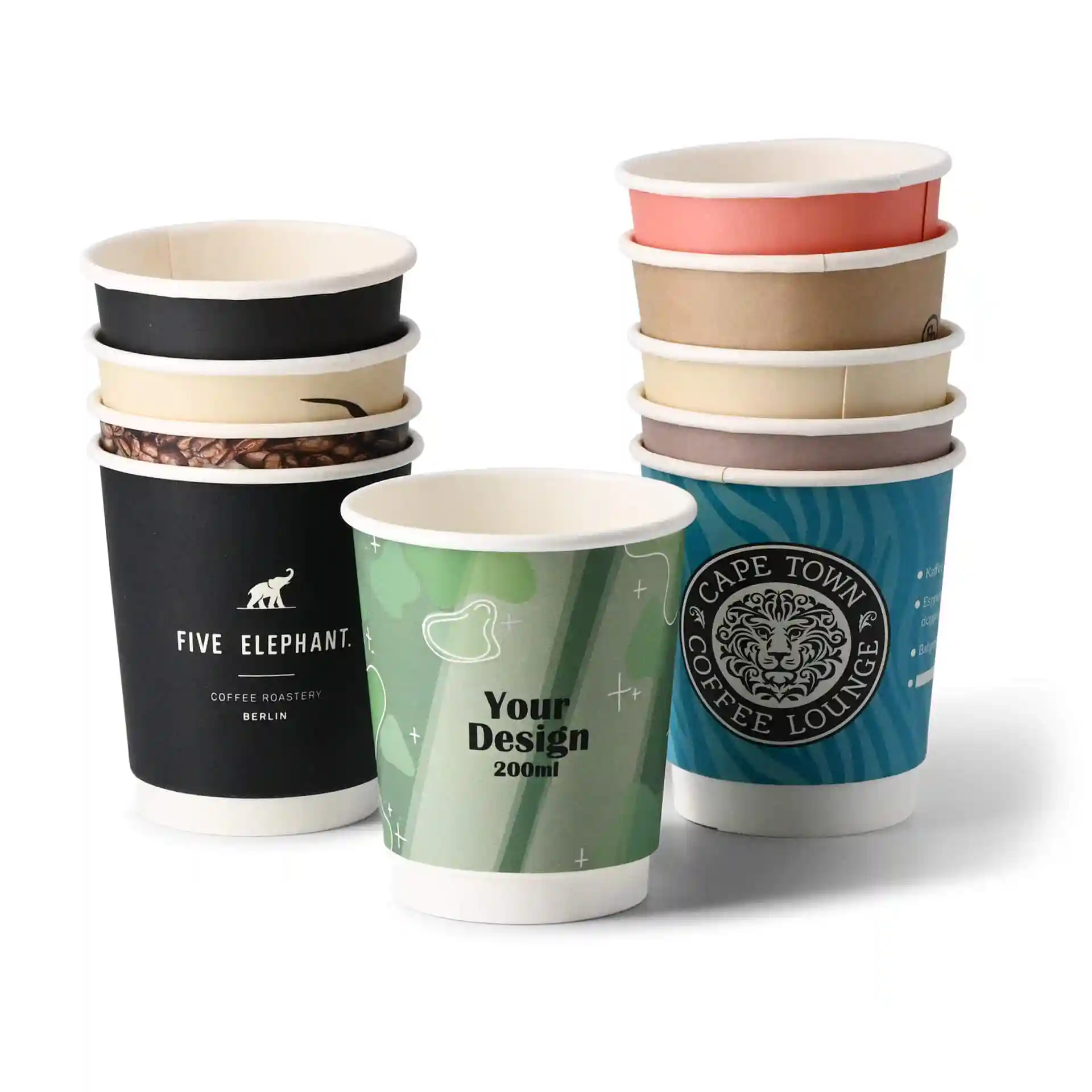 Stack of custom printed paper cups in various designs, including a green cup with "Your Design" label, on a white background.