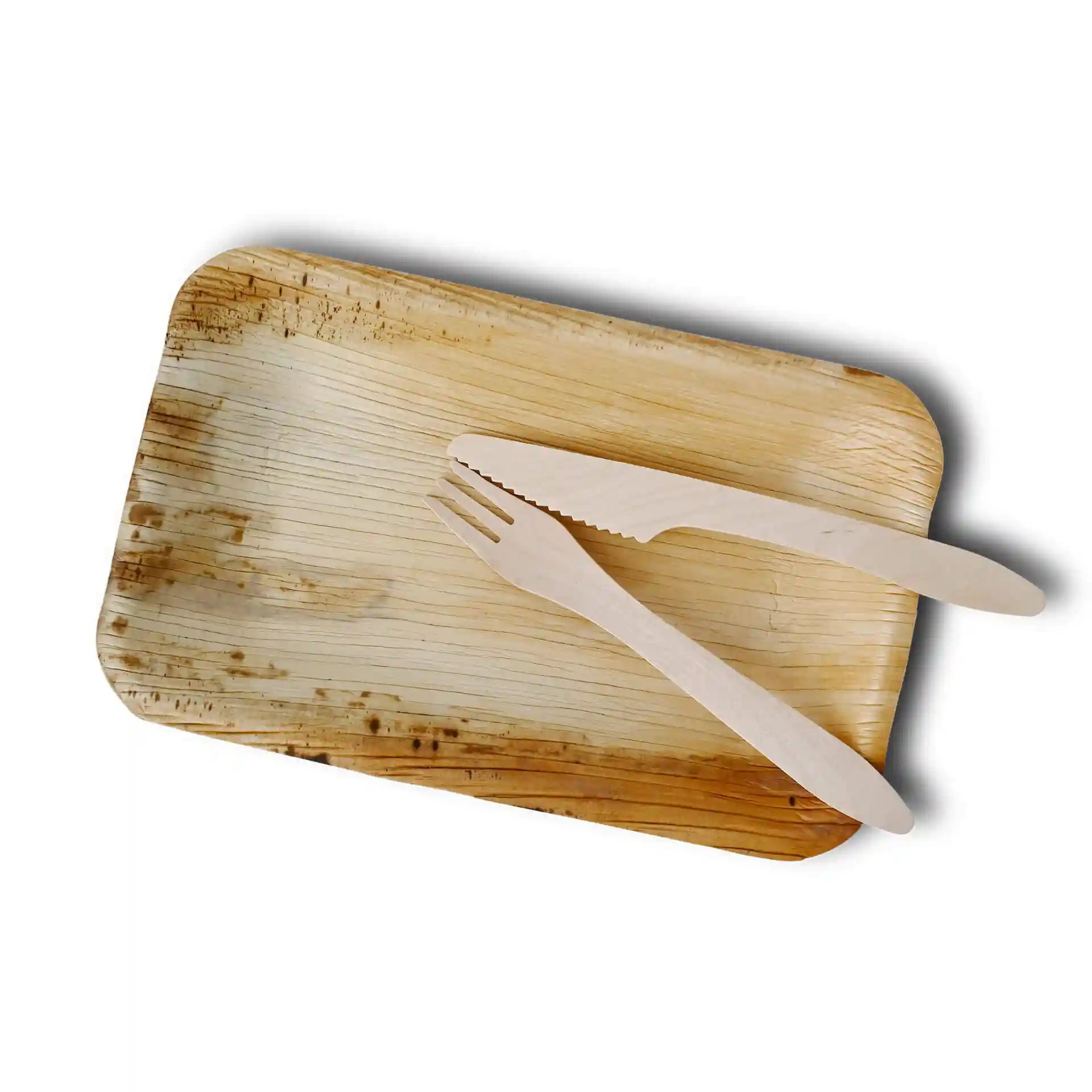 Rectangular palm leaf plate with a grain texture, accompanied by a wooden fork and knife.