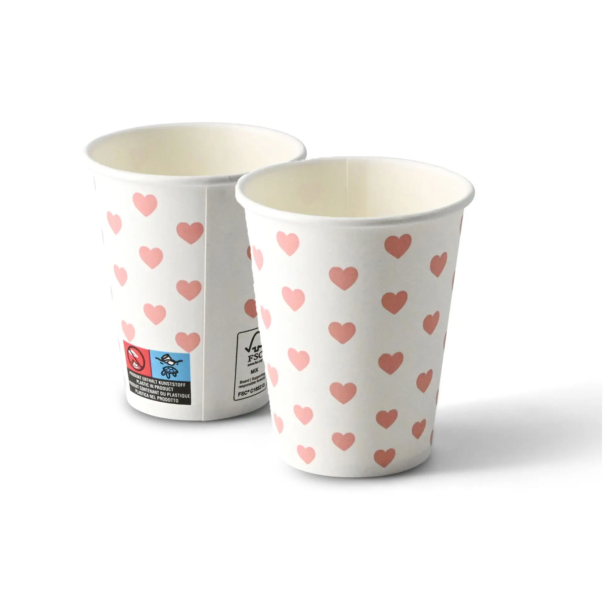 One white paper cup with a pink hearts print design; another cup with a similar pattern shown beside it.