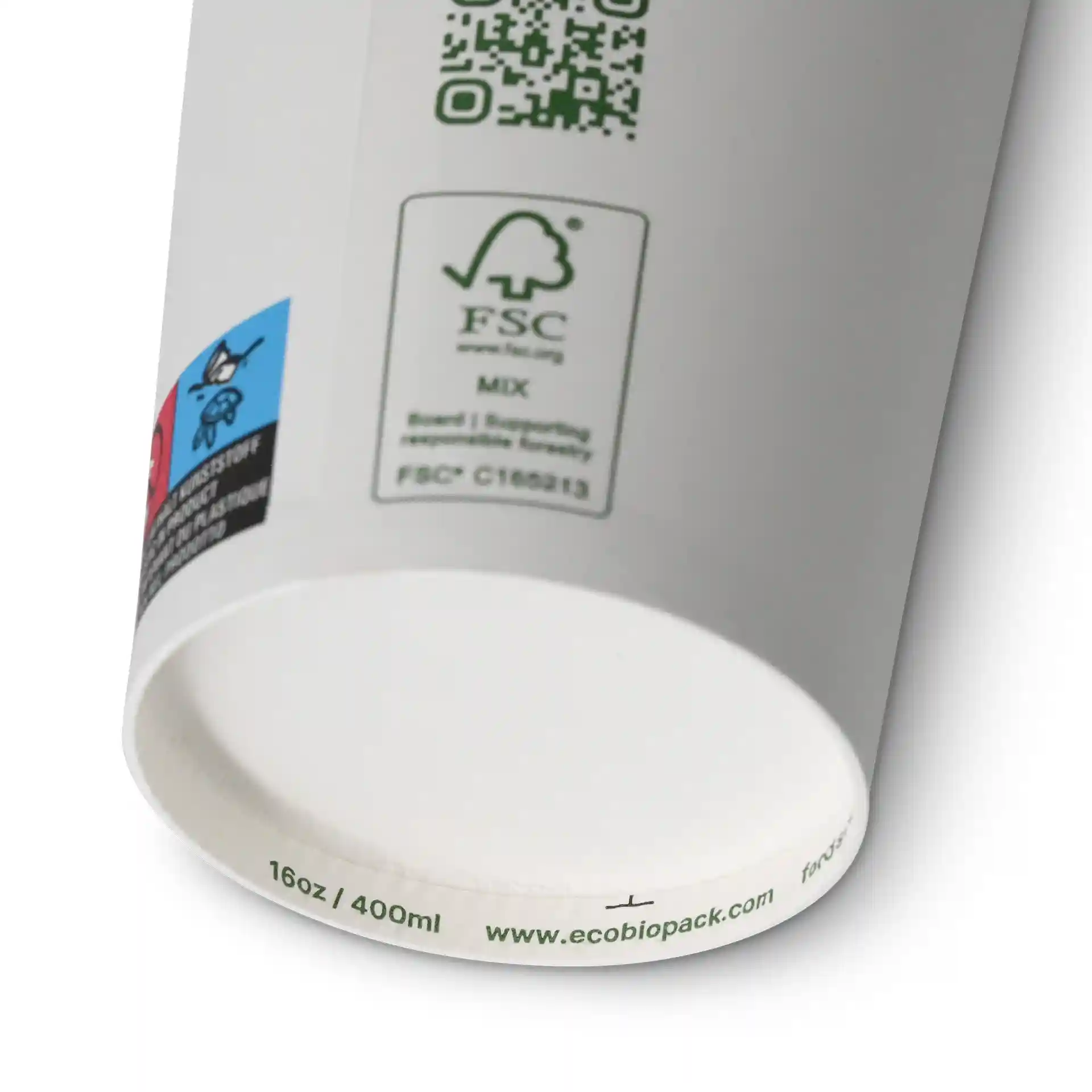 White paper cup with a PLA coating, showing a QR code and various labels on the side.