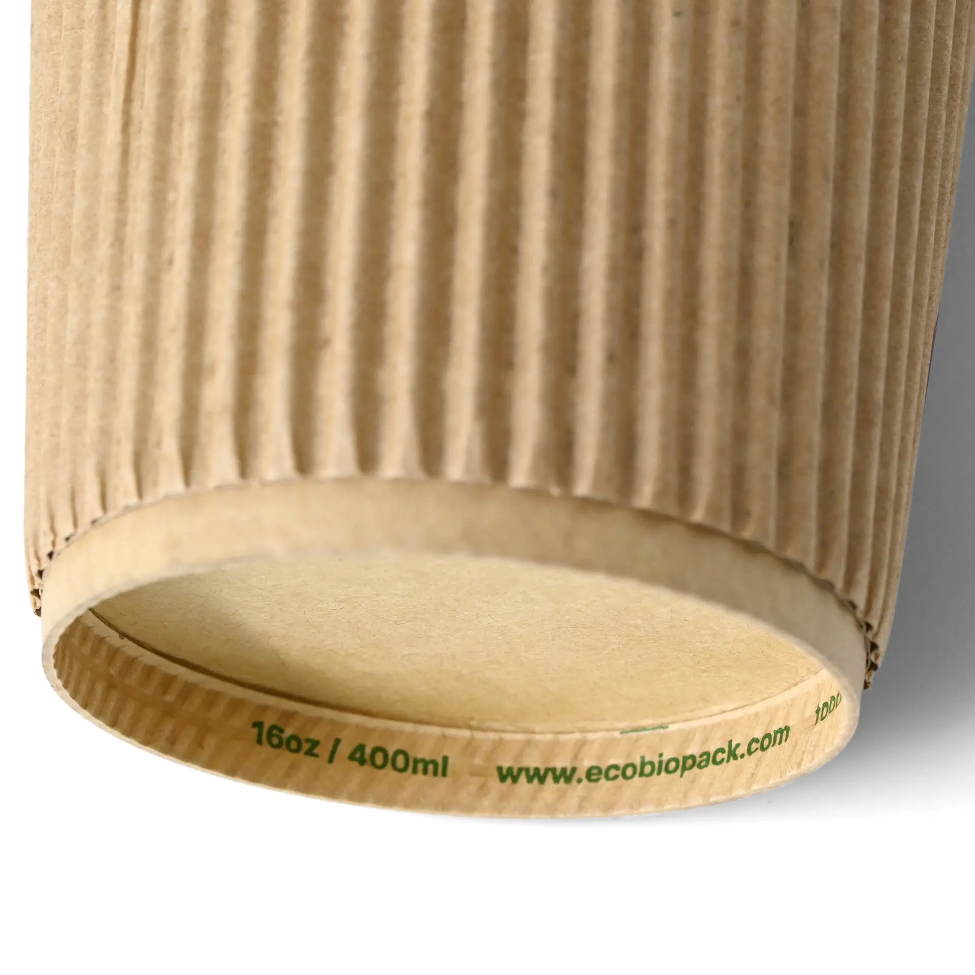 Brown triple-walled ribbed disposable coffee cup with a PLA inner coating, suitable for hot drinks, 16 oz capacity.