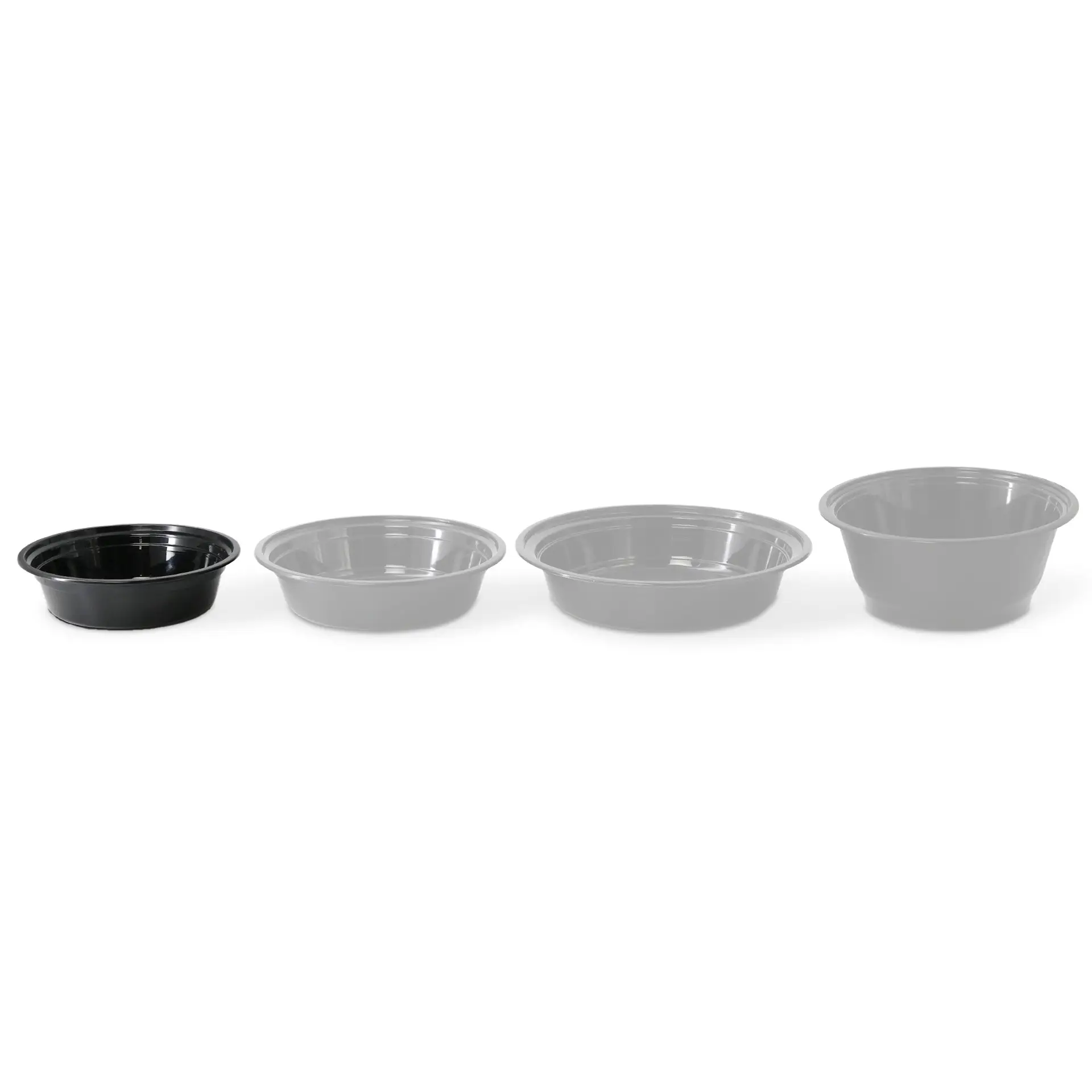 Four round reusable plates made of black polypropylene; varying sizes shown with one in focus and others faded.