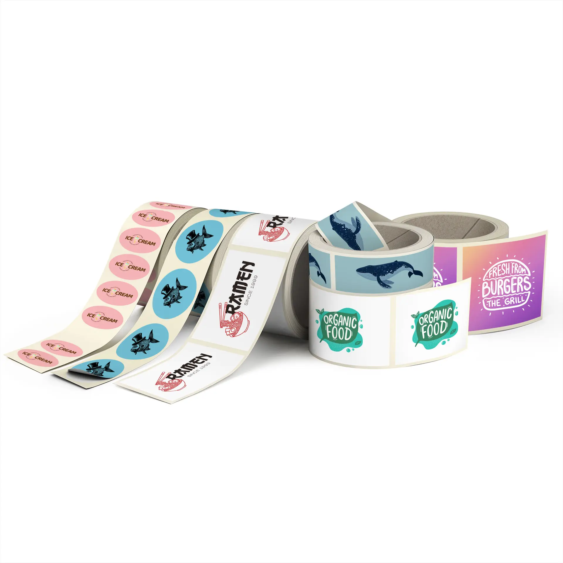 Custom printed labels on rolls featuring various designs, including food-related motifs and colors.