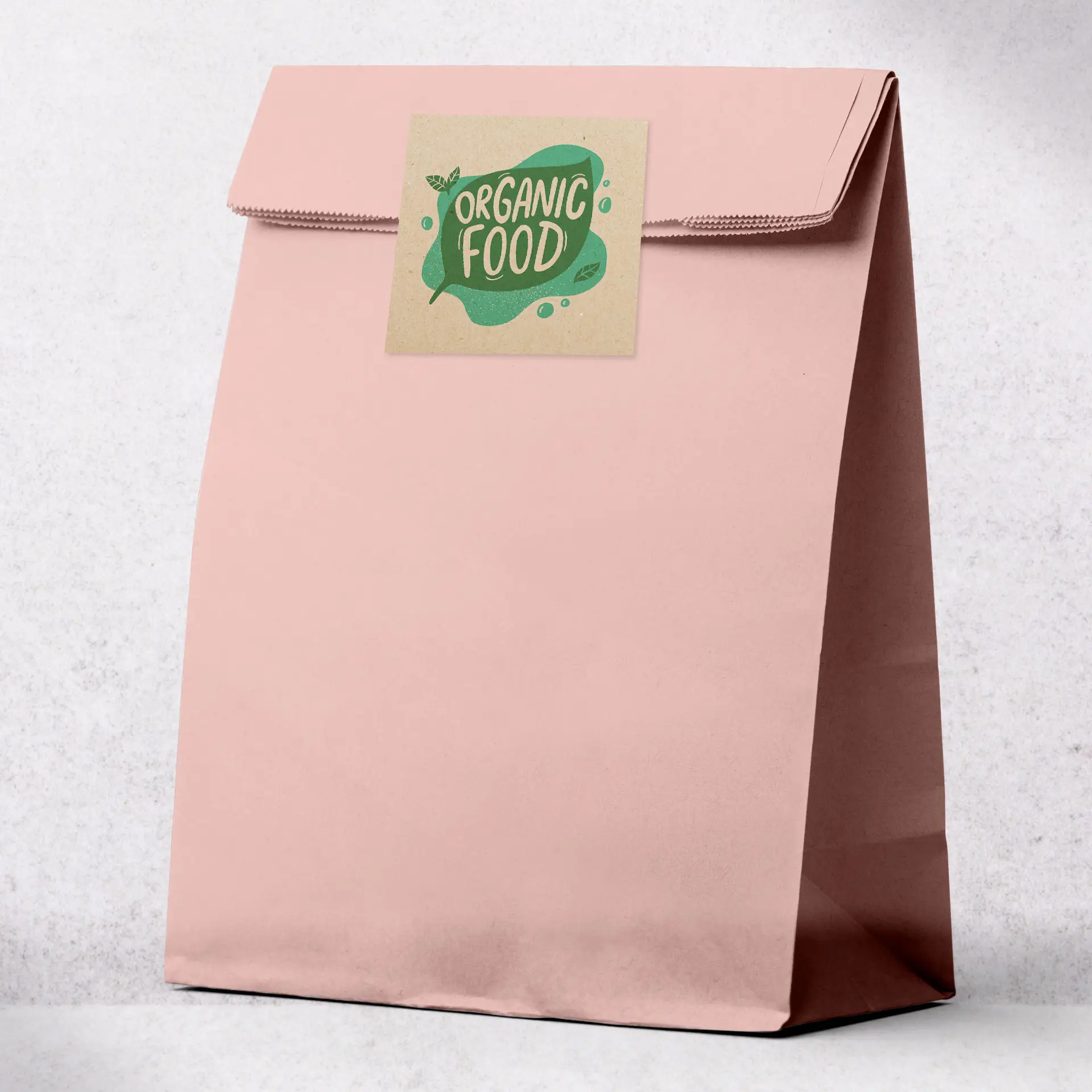 Pink kraft paper bag with a square label featuring the text "Organic Food" and decorative elements.