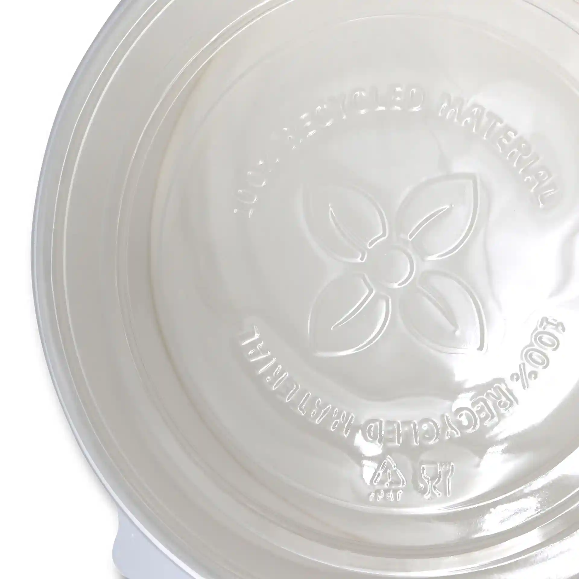 Transparent round cup lid made of rPET, showing embossed markings on the interior surface.