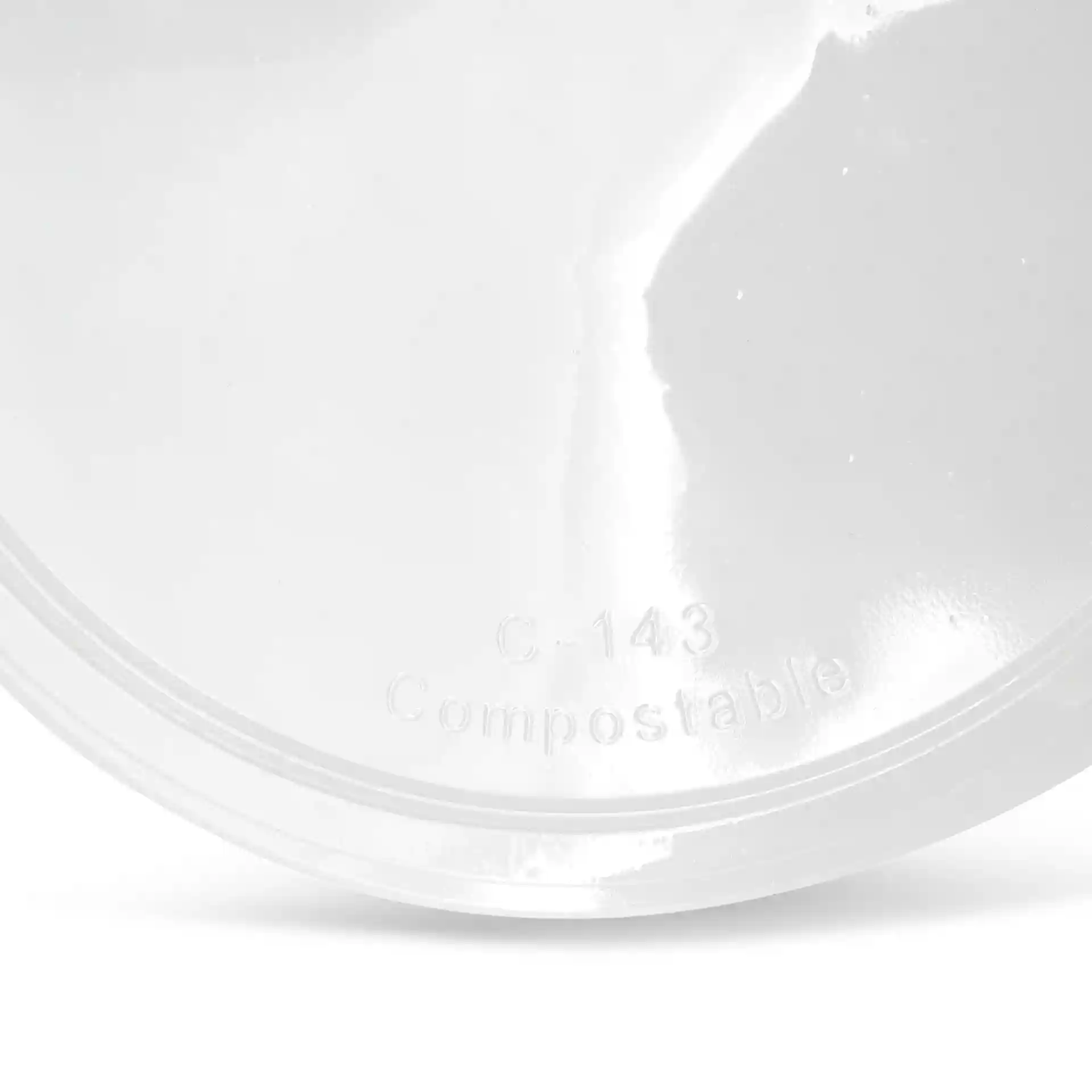 Transparent round lid for deli cups, measuring 143 mm in diameter, with visible markings on the surface.