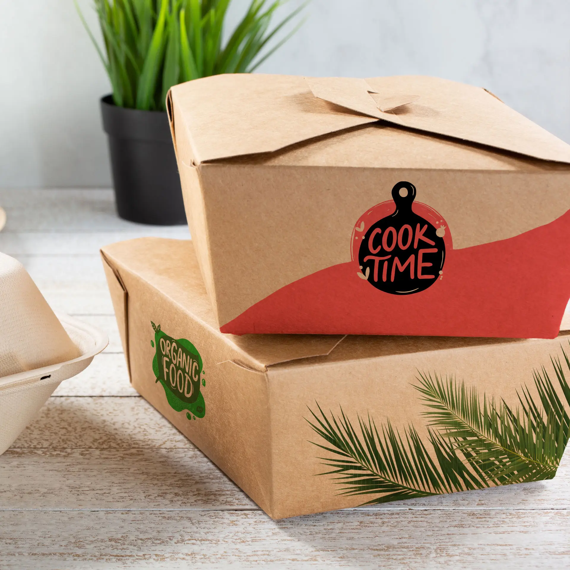 Two customisable takeaway boxes in brown cardboard; one features a "Cook Time" label, the other displays "Organic Food" with palm leaves.