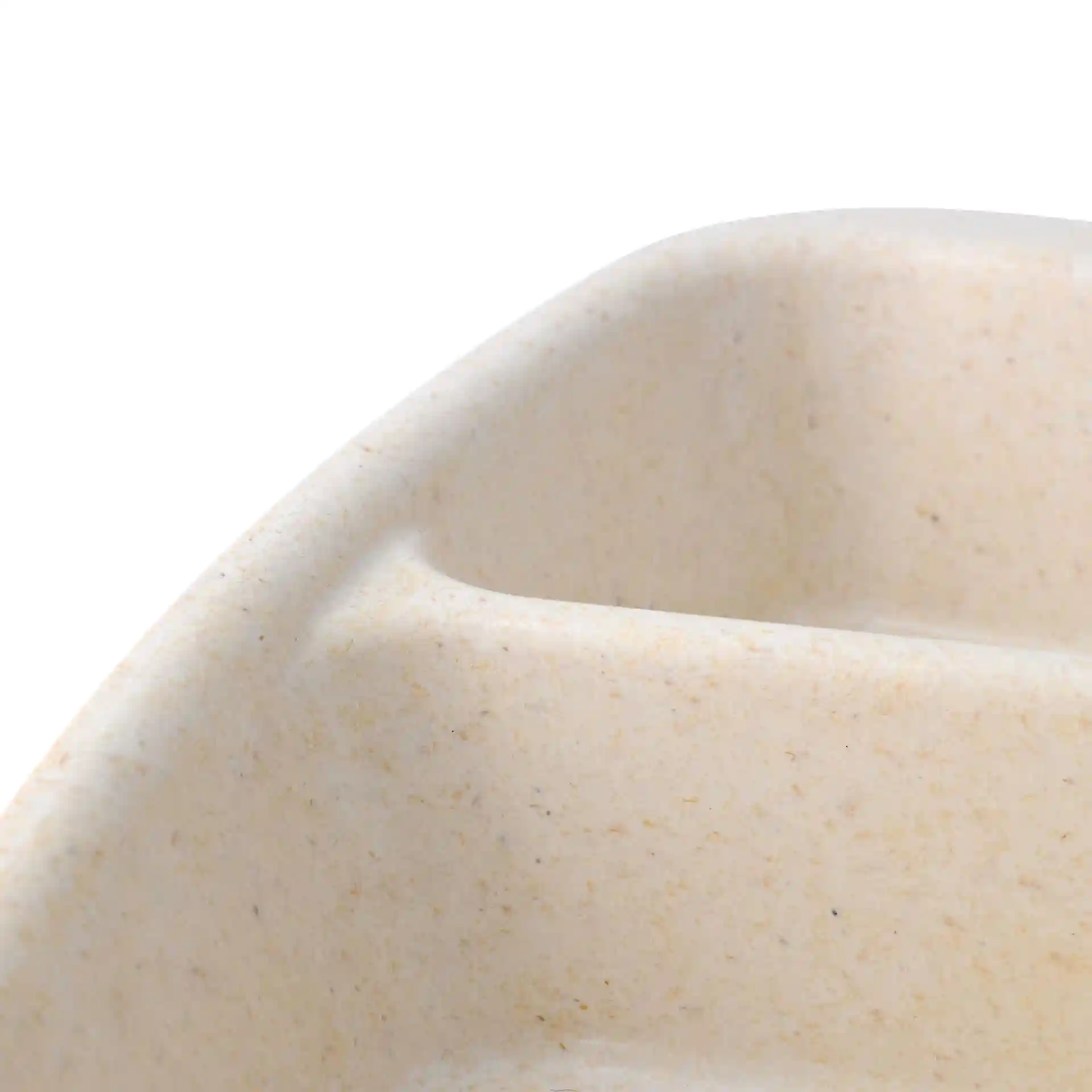 Close-up of a reusable meal container with three compartments, featuring a creamy white bio compound surface.