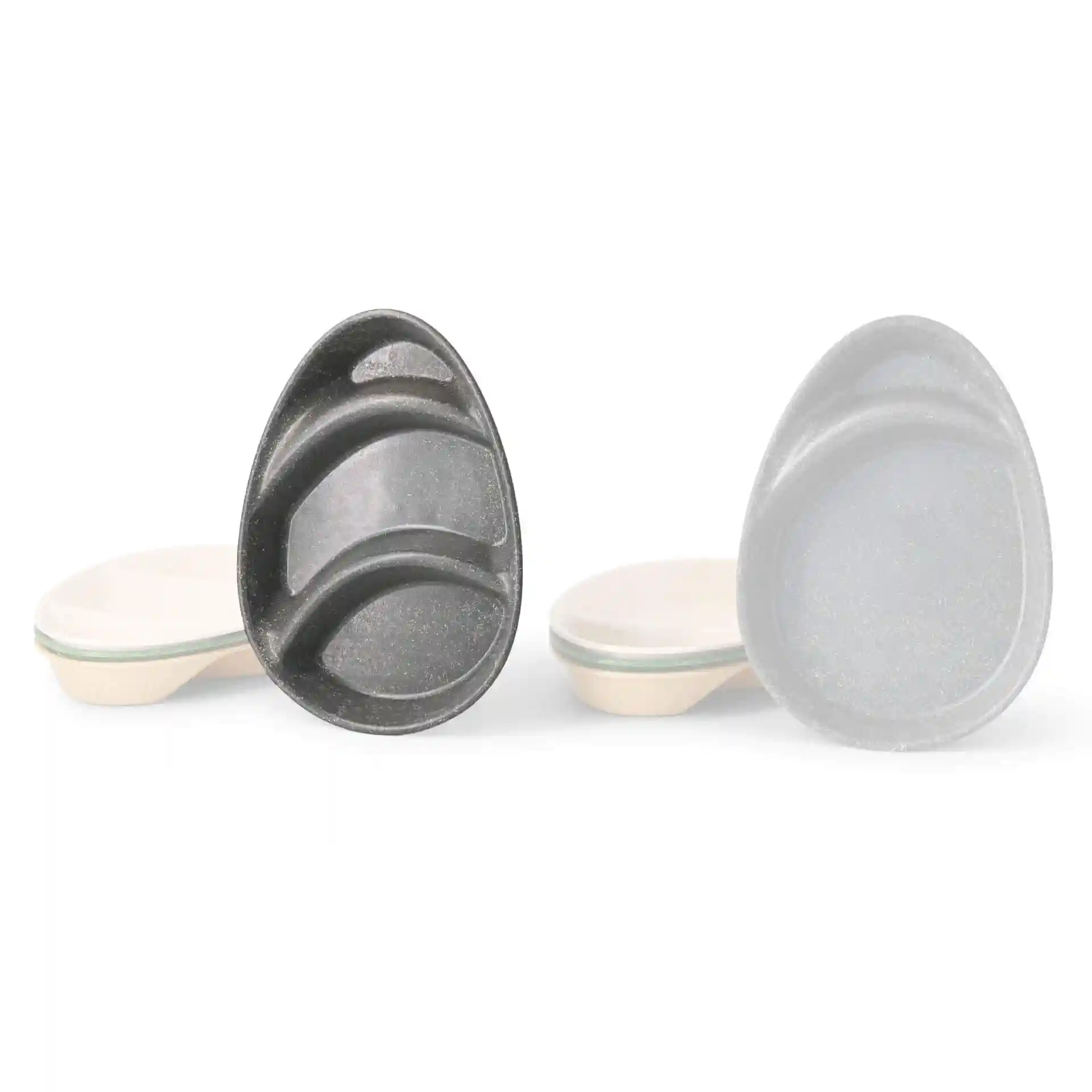 Reusable divided plate in teardrop shape with three compartments, grey color, and a smooth surface.