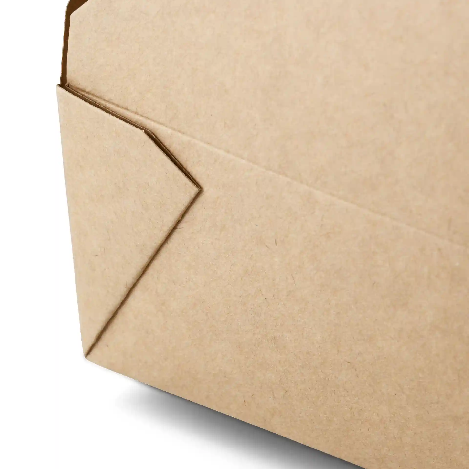 Close-up of a brown cardboard takeaway container with a folded corner.