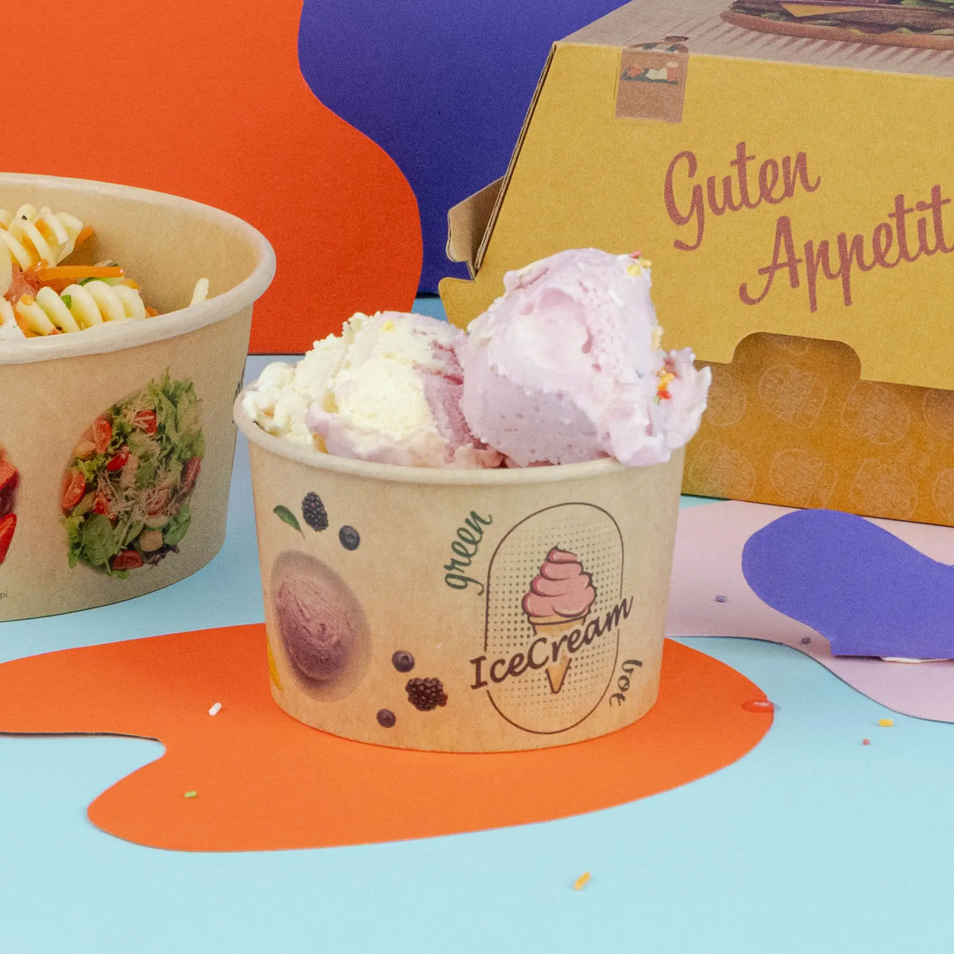 Brown ice cream cup with pink and white scoops of ice cream, next to a pasta bowl and a takeout box.