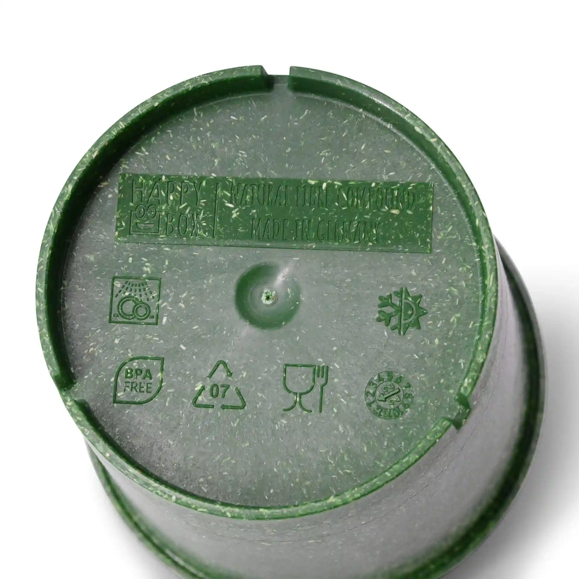 Green reusable cup with a round shape and a textured bottom, featuring various symbols and markings on the base.